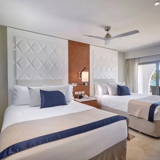 Royalton Grenada suite with two beds and a view of the beach, St. George’s