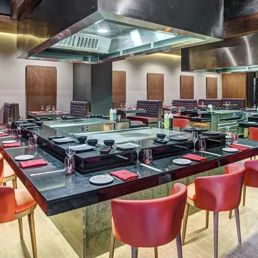 Teppanyaki dining table with red chairs at Royalton Hideaway Saint Lucia, Castries