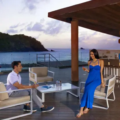Couple enjoying drinks at Aquarius Bar overlooking the ocean at Royalton Hideaway Saint Lucia, Castries