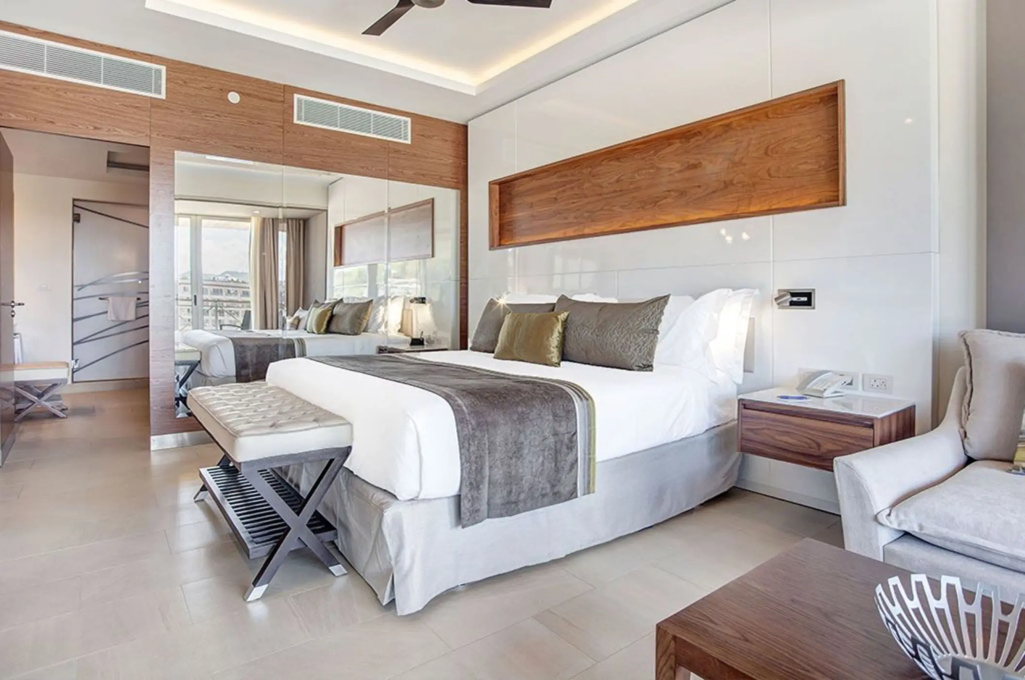 Royalton Hideaway Saint Lucia Diamond Club suite with king bed and wood paneling, Castries