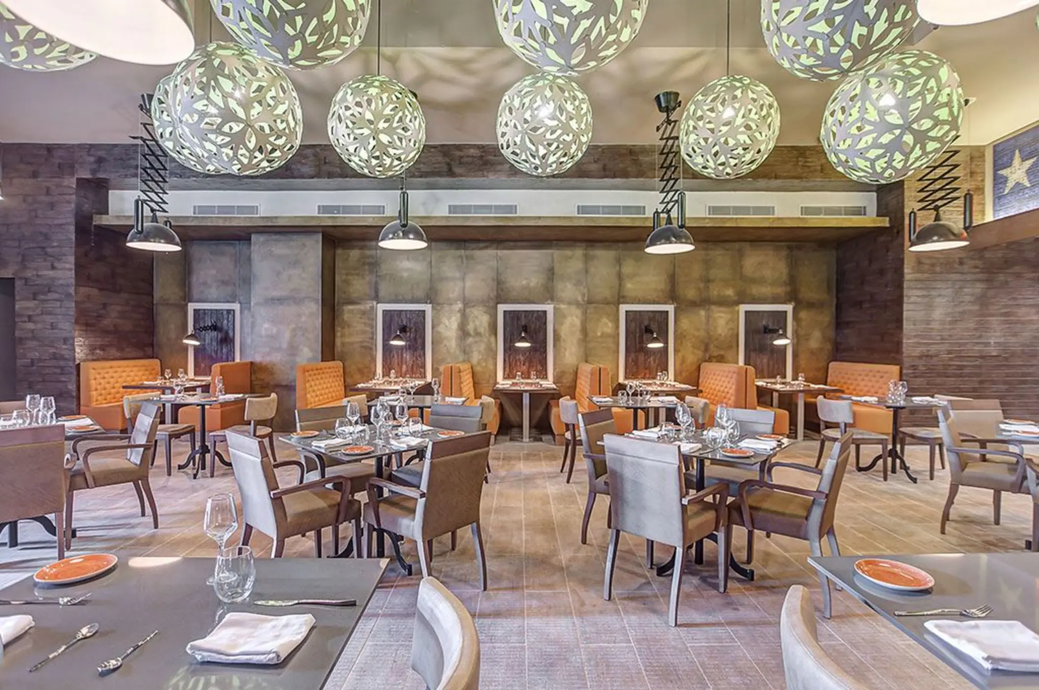Modern restaurant dining room with decorative globe lighting at Royalton Hideaway Saint Lucia, Castries