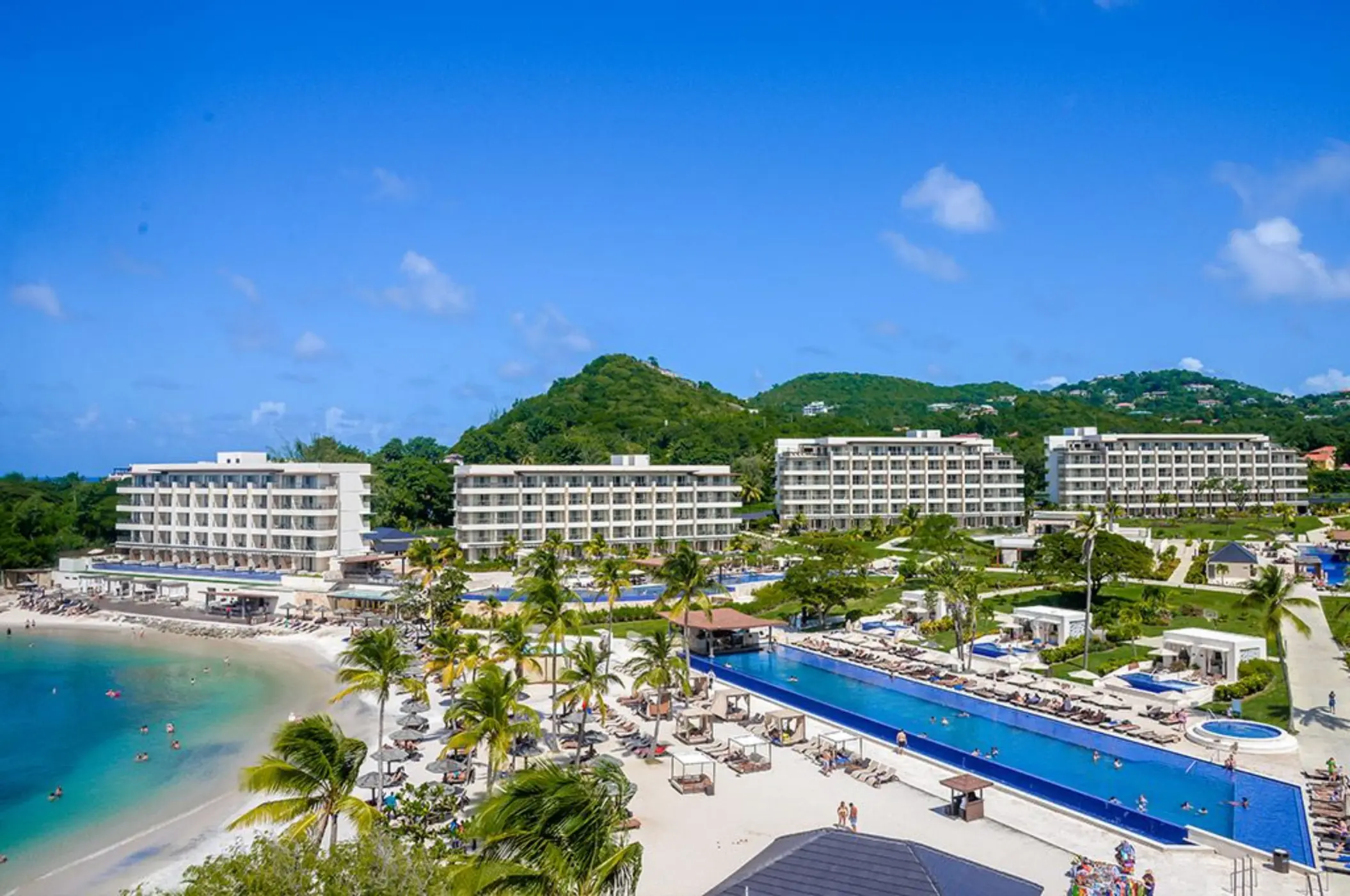 Aerial view of Royalton Hideaway Saint Lucia pools, beach, and guest buildings, Castries