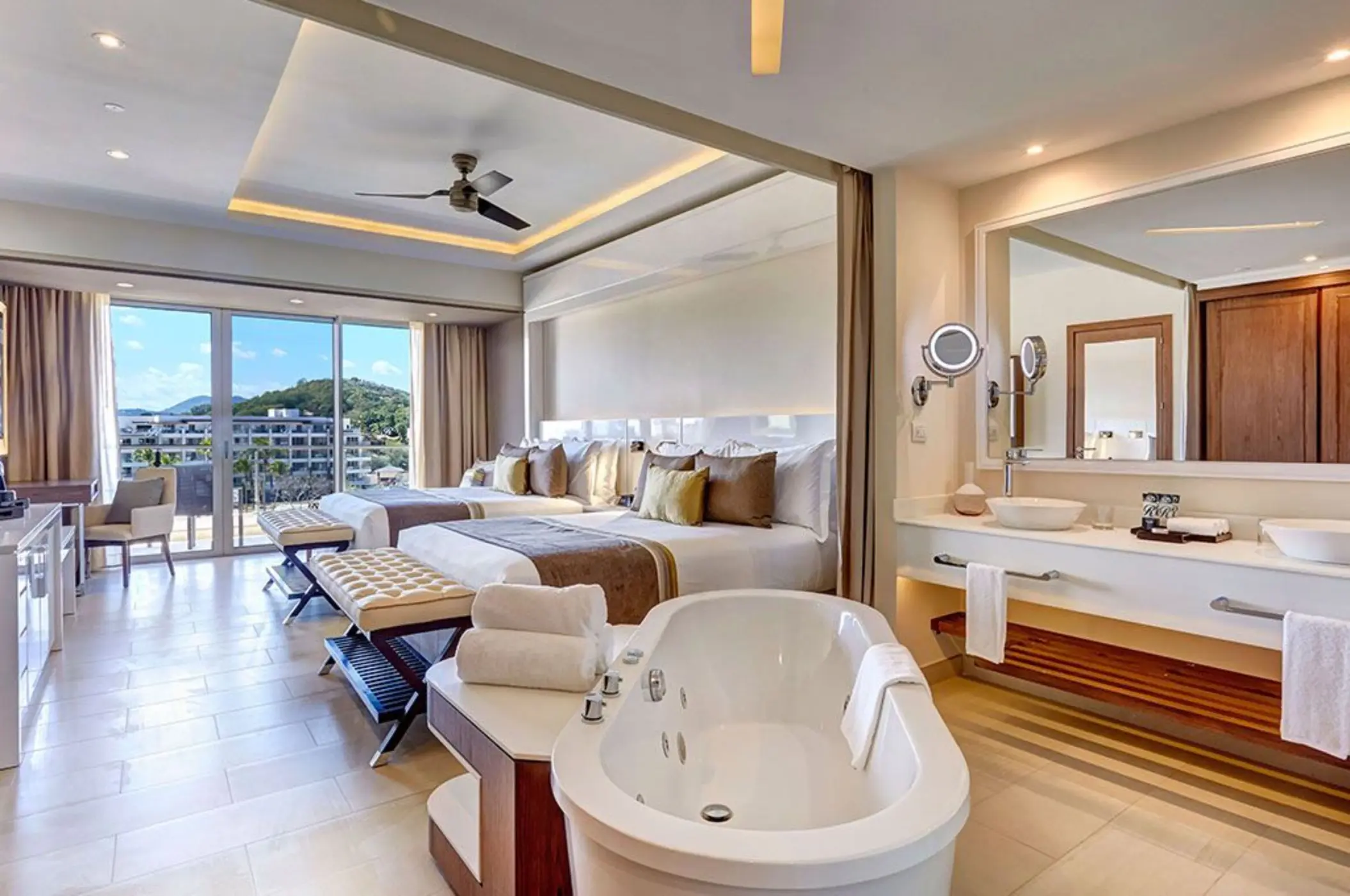 Modern suite with a white soaking tub and double beds at Royalton Hideaway Saint Lucia, Castries