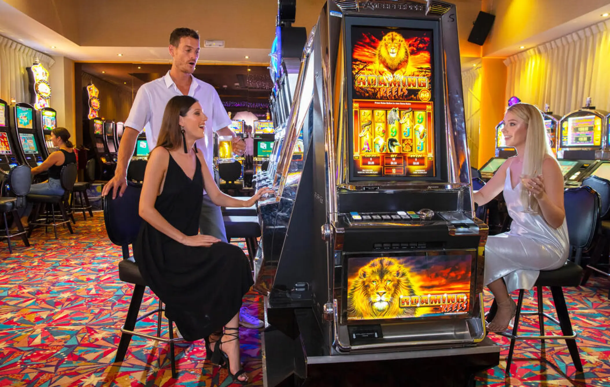 Guests playing slot machines at the Royalton Punta Cana casino, Punta Cana