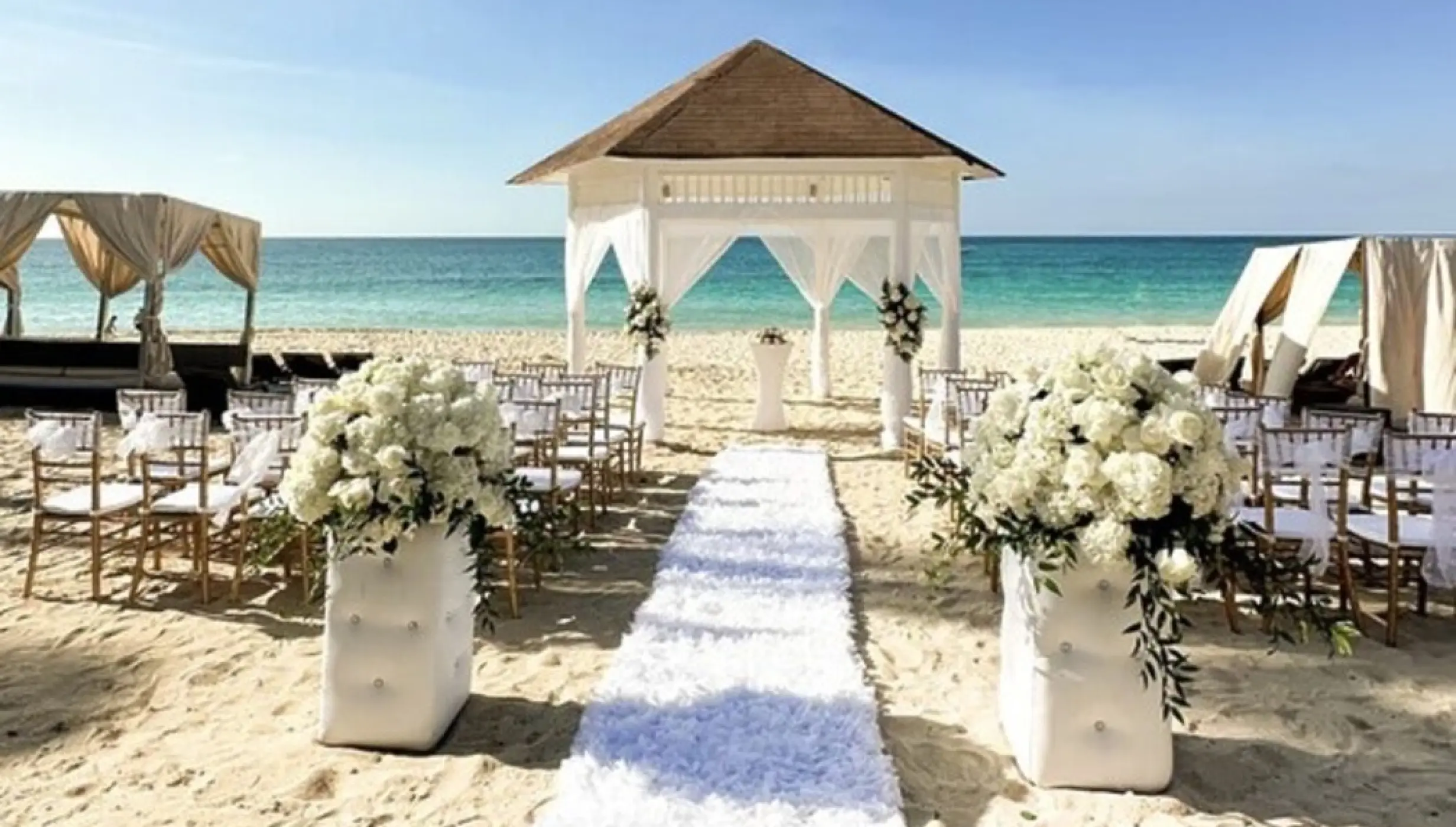 Beachfront wedding ceremony setup with a gazebo at Royalton Punta Cana, Punta Cana