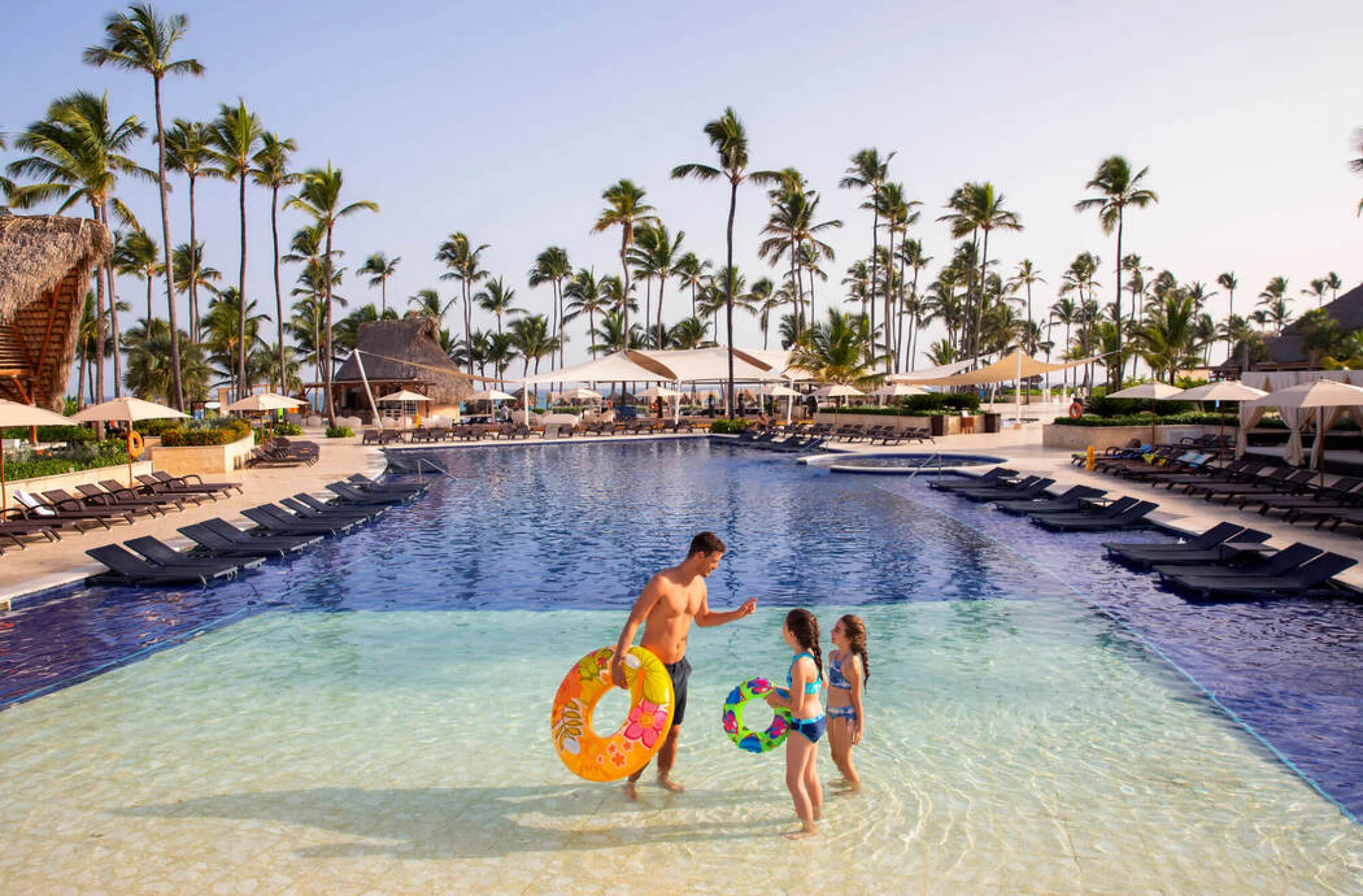 family at the main pool at Royalton Punta Cana