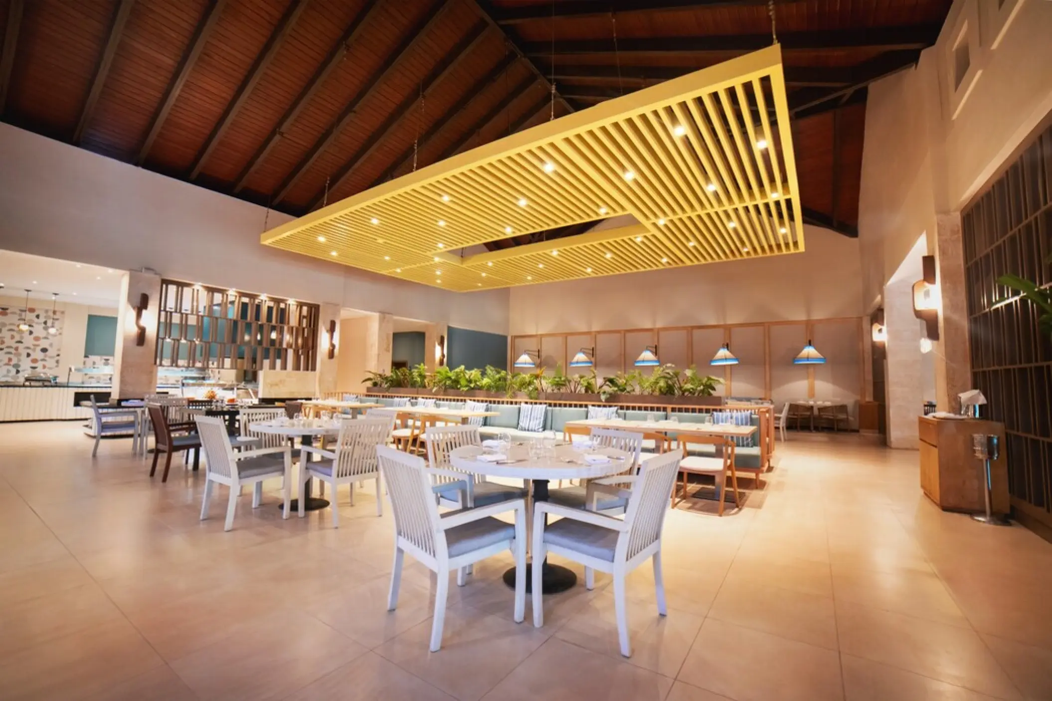 Gourmet Marche restaurant with a modern yellow ceiling installation at Royalton Punta Cana, Punta Cana