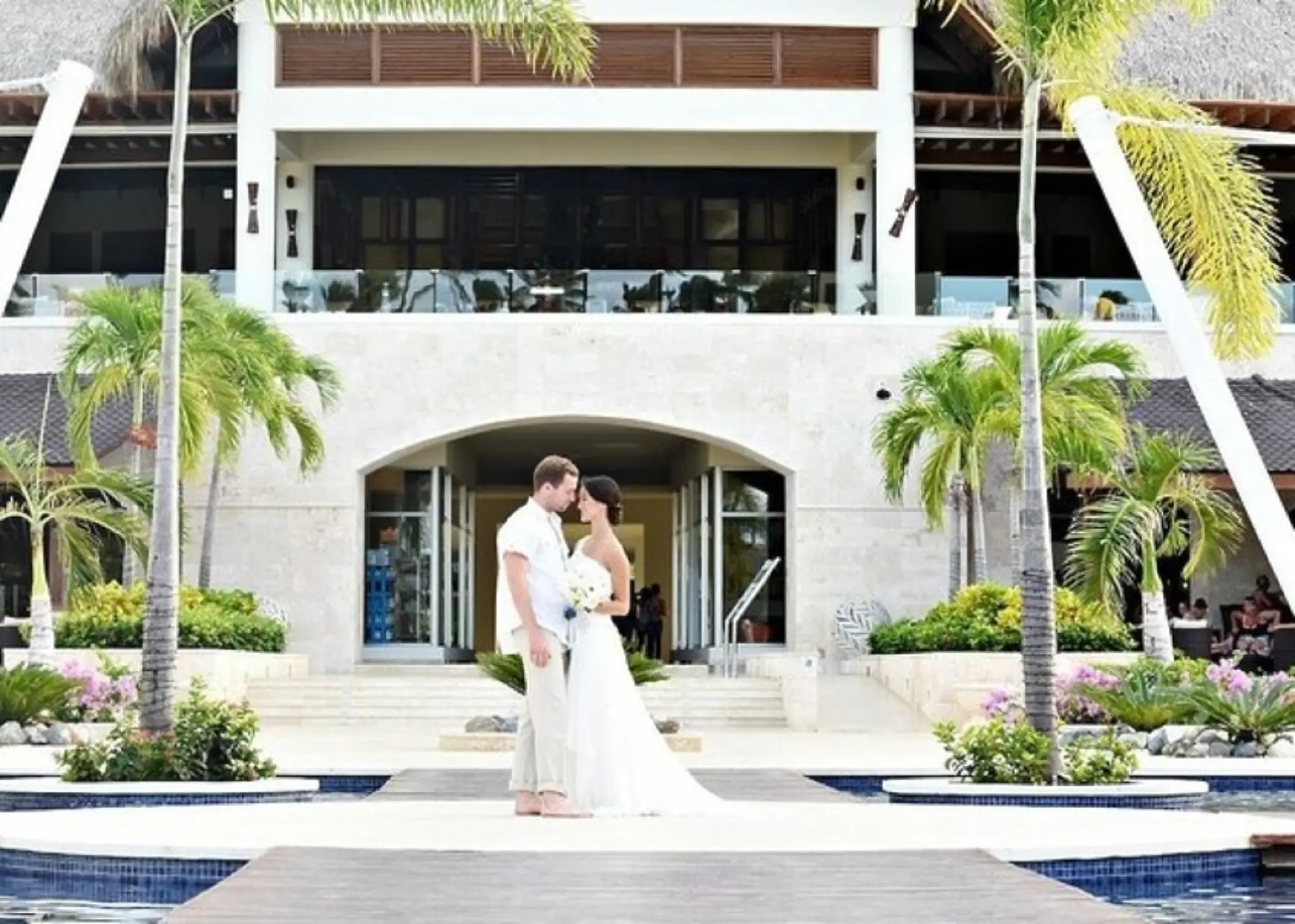 The bride and groom posing at the Plaza Lobby Circle venue at Royalton Punta Cana, Punta Cana