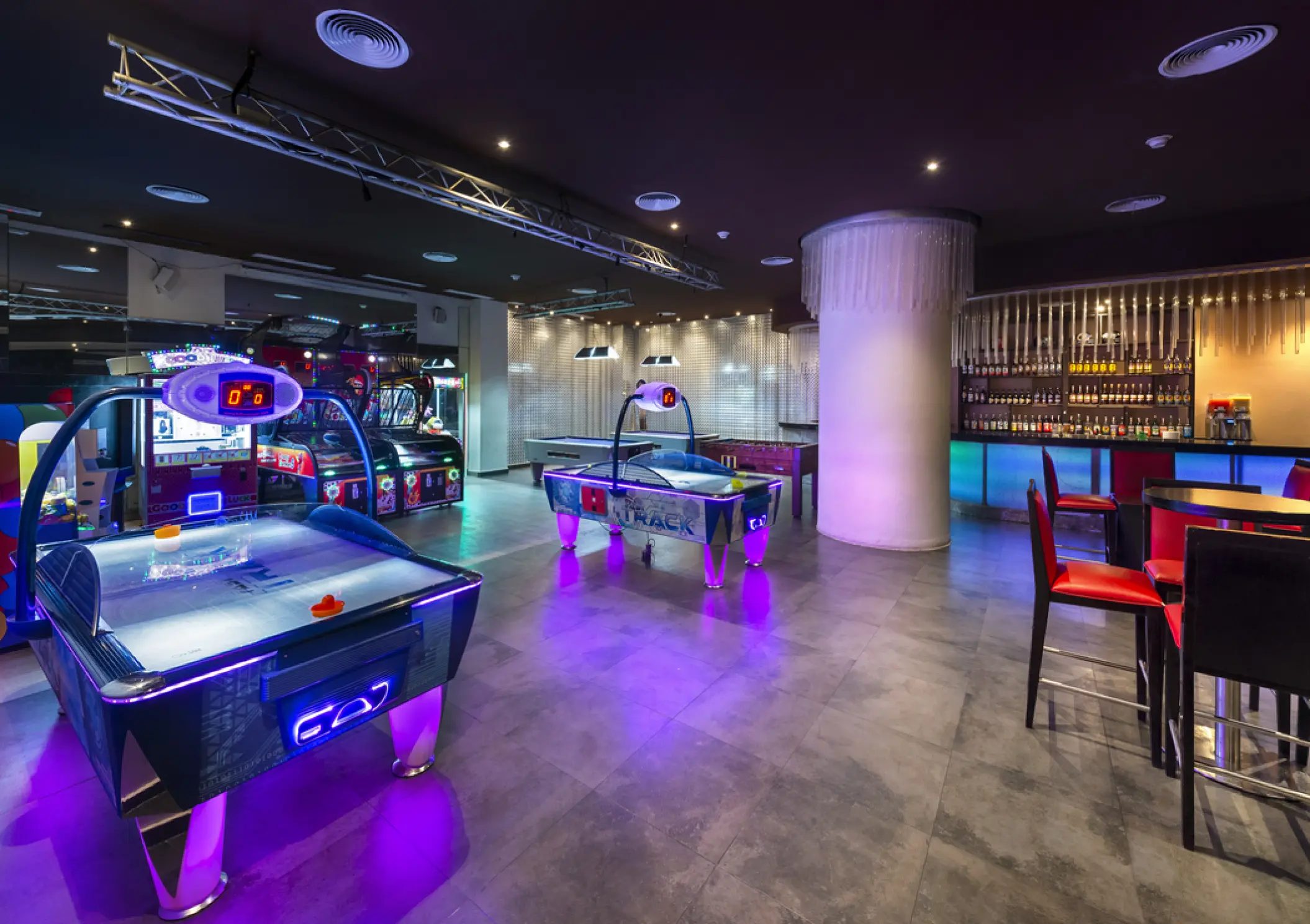 Sports bar and arcade room with air hockey tables at Royalton Punta Cana