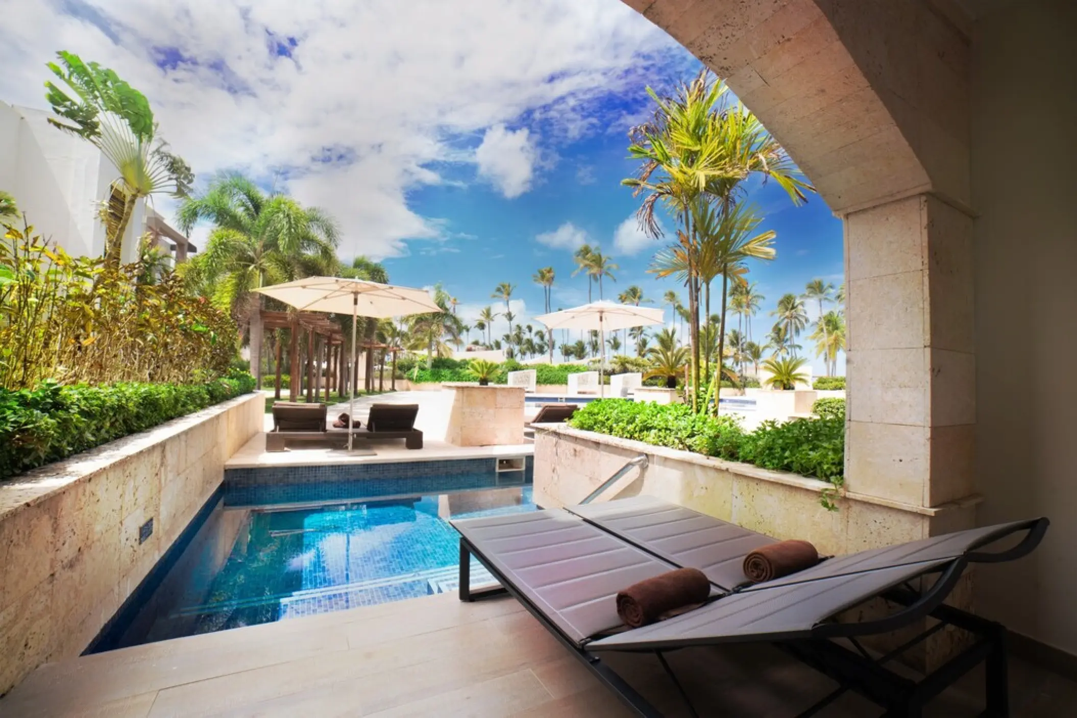 Swim-out suite with sun loungers and a private terrace at Royalton Punta Cana