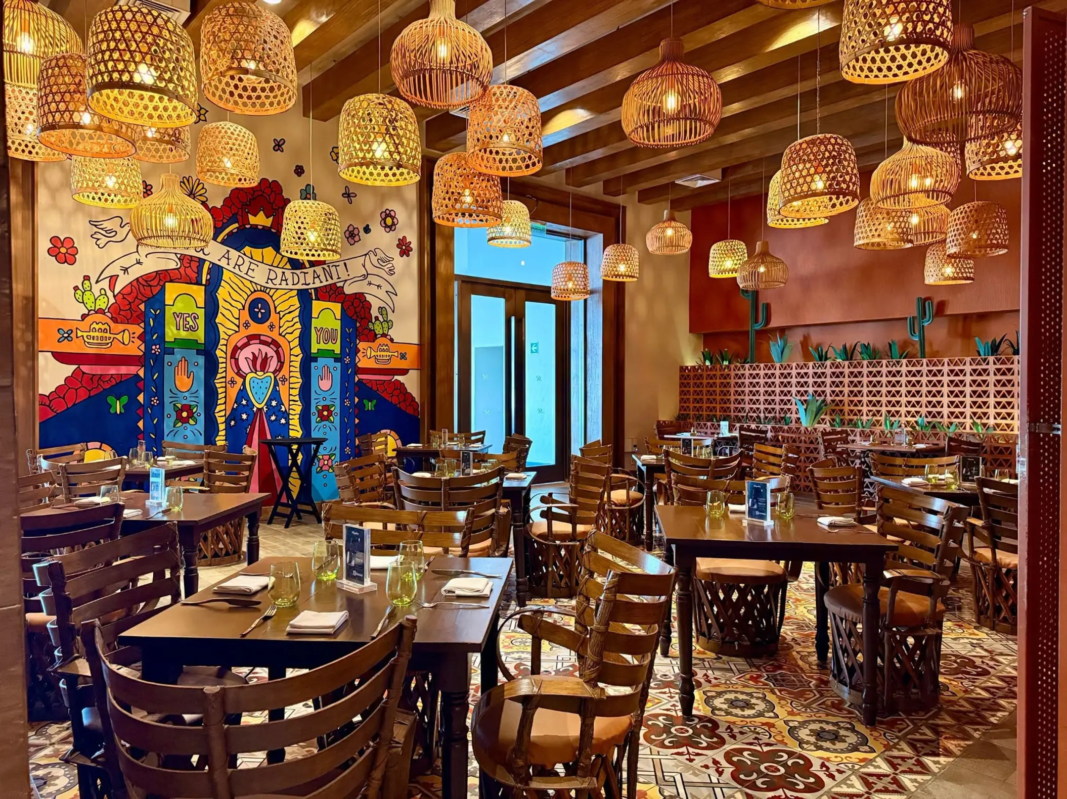 Authentic Mexican restaurant with woven lantern lighting and colorful mural at Royalton Riviera Cancun, Cancun