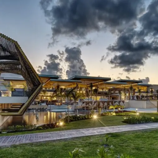 Illuminated geometric structures and modern buildings at Royalton Riviera Cancun at dusk, Cancun