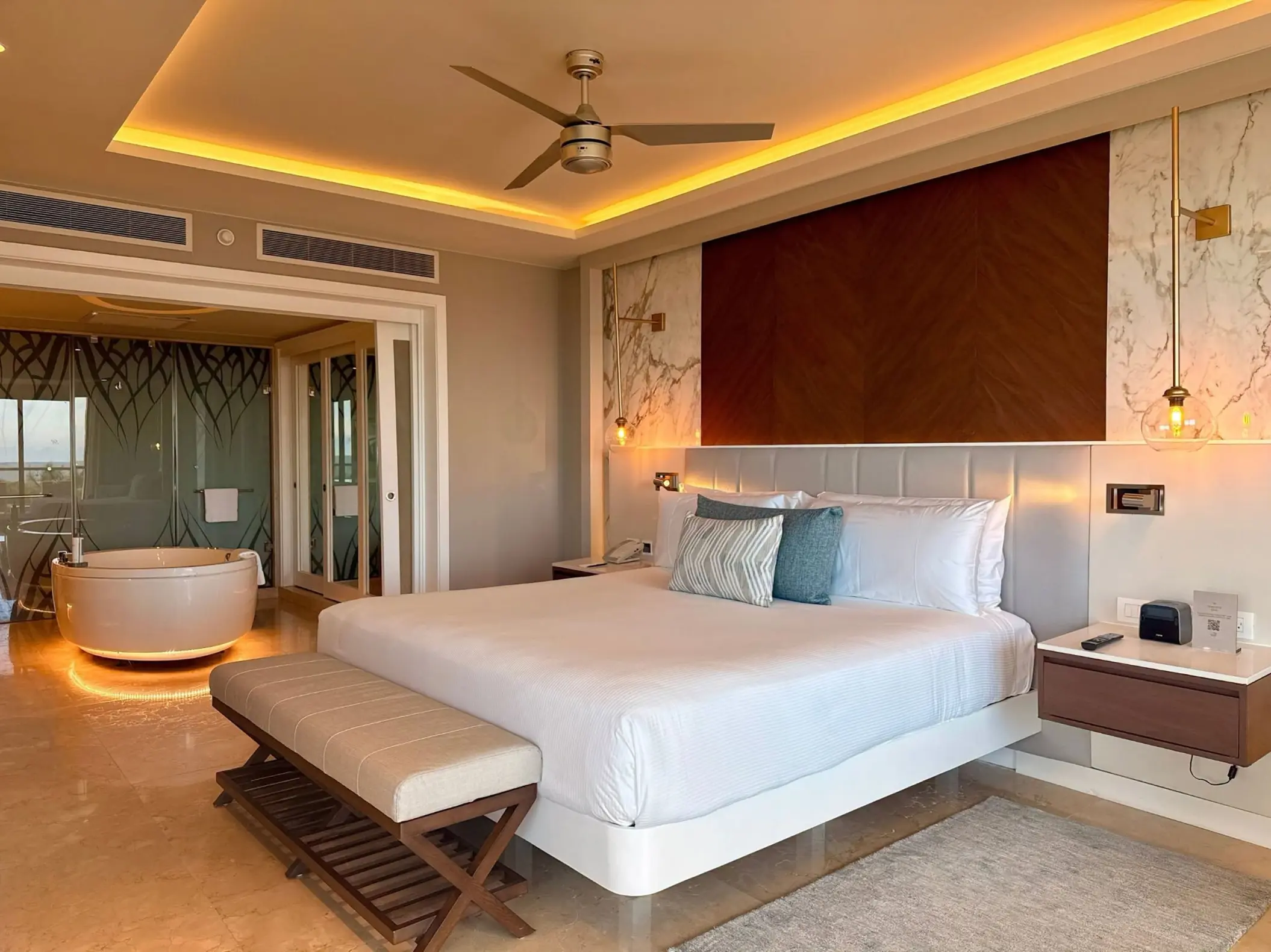 Modern suite with a king bed and indoor whirlpool tub at Royalton Riviera Cancun, Cancun