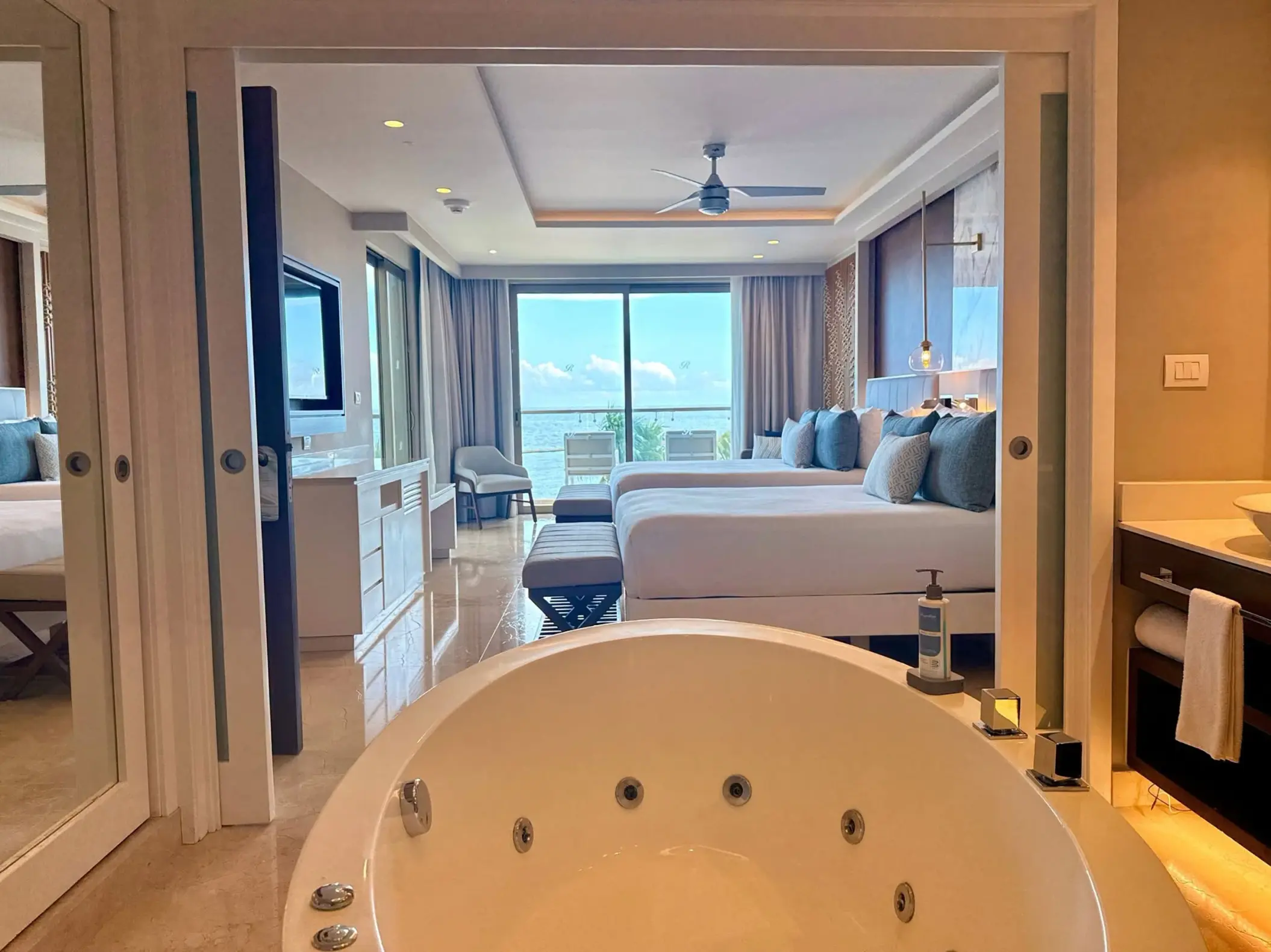 Luxury suite with whirlpool tub and ocean view balcony at Royalton Riviera Cancun, Cancun