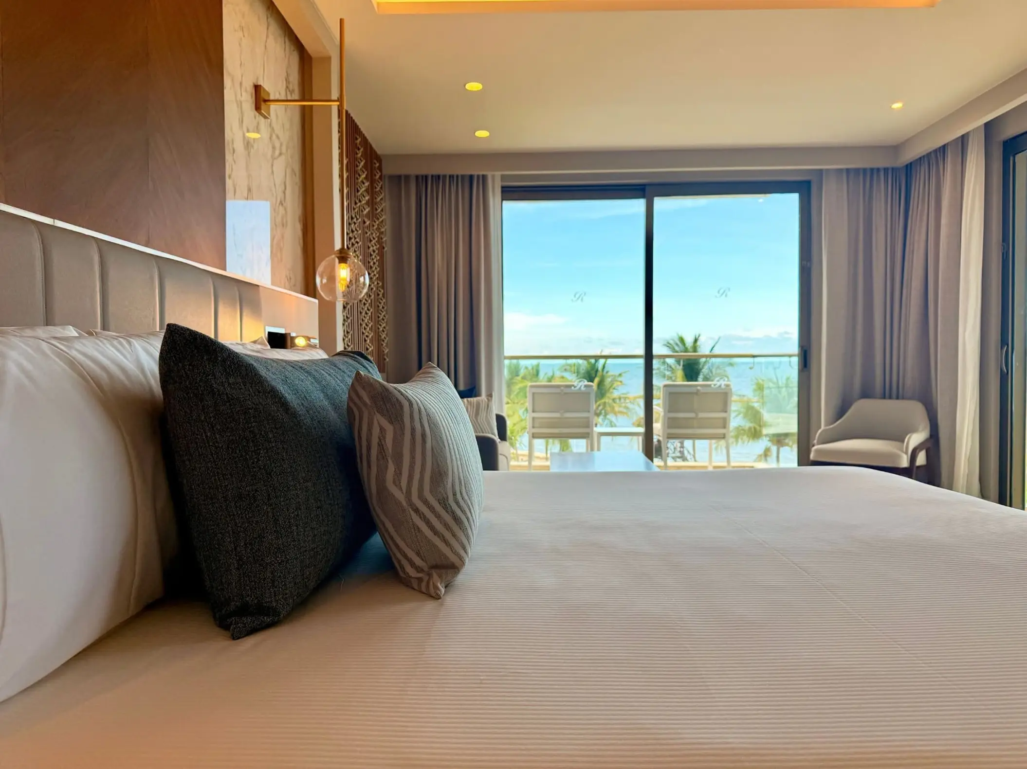 Modern suite with ocean view balcony at Royalton Riviera Cancun