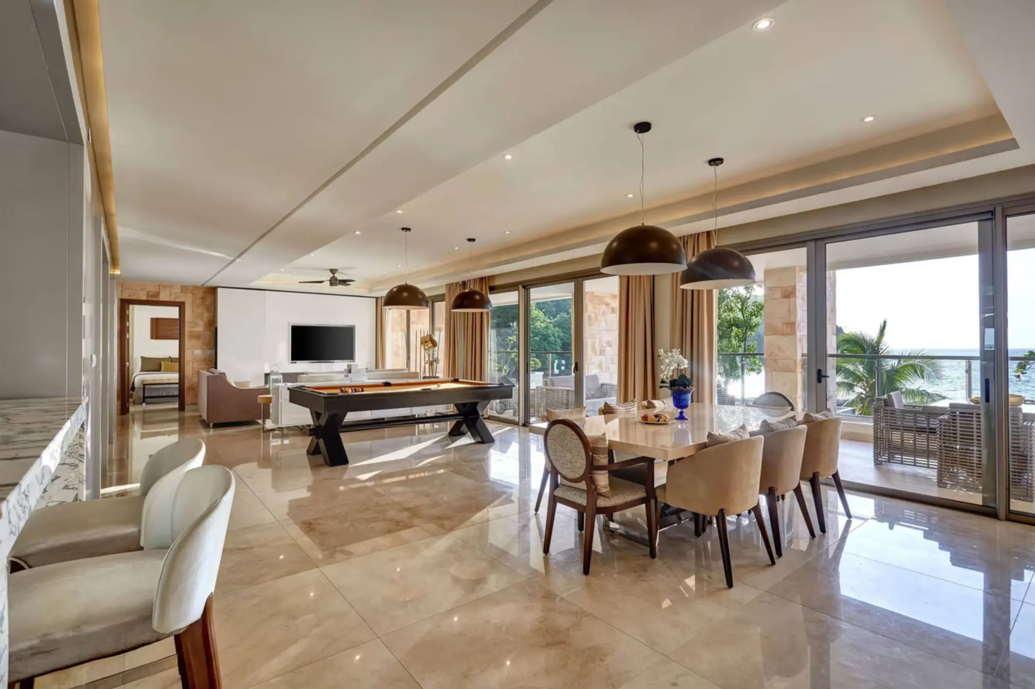 Chairman Suite living area with pool table and balcony at Royalton Saint Lucia, Castries