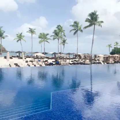 Royalton Saint Lucia infinity pool overlooking the beach and palm trees, Castries