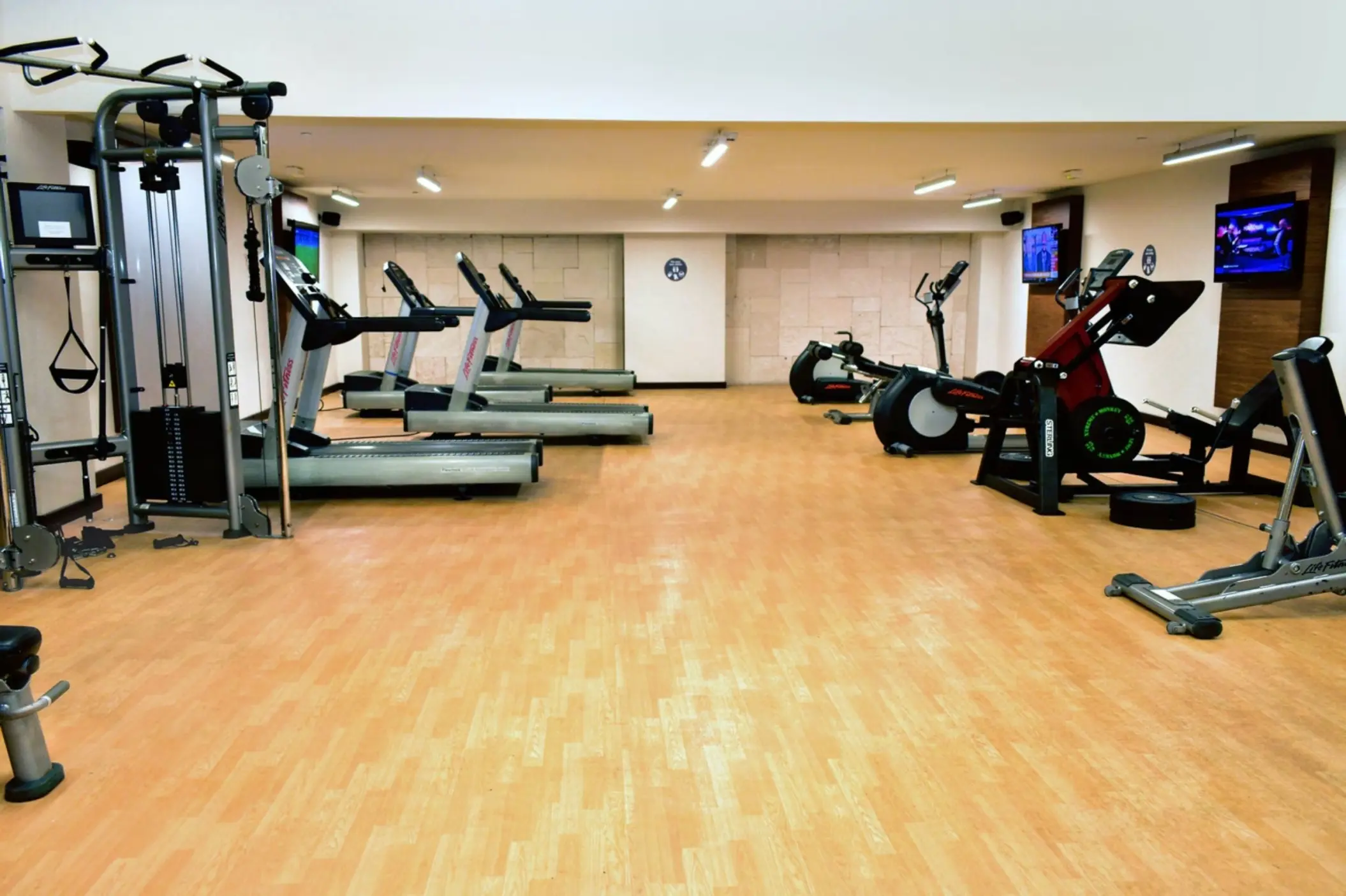 Modern gym with treadmills, stationary bikes, and weight machines at Royalton Saint Lucia, Castries
