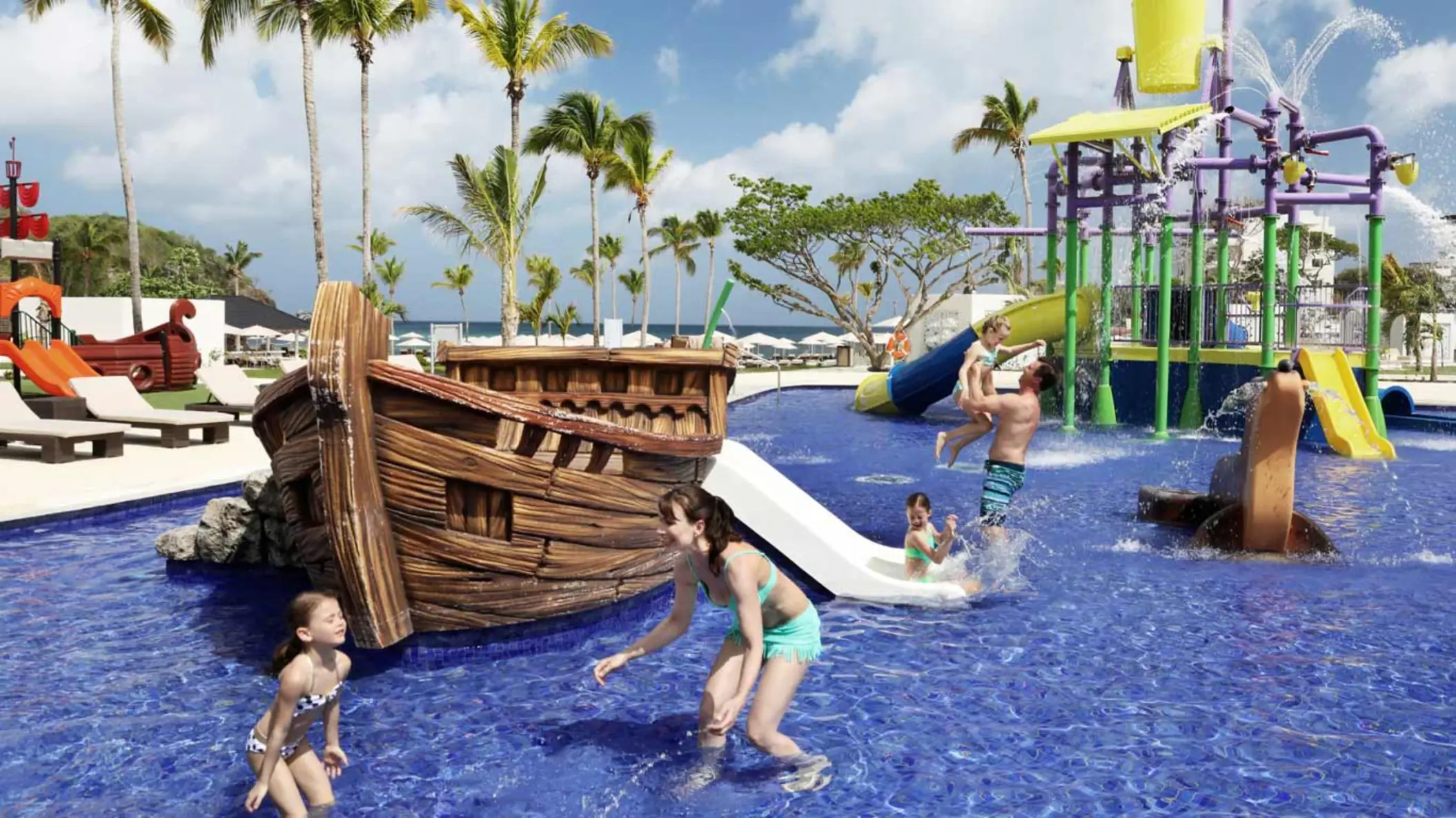 Children and parents playing in the pirate-themed kids pool at Royalton Saint Lucia, Castries