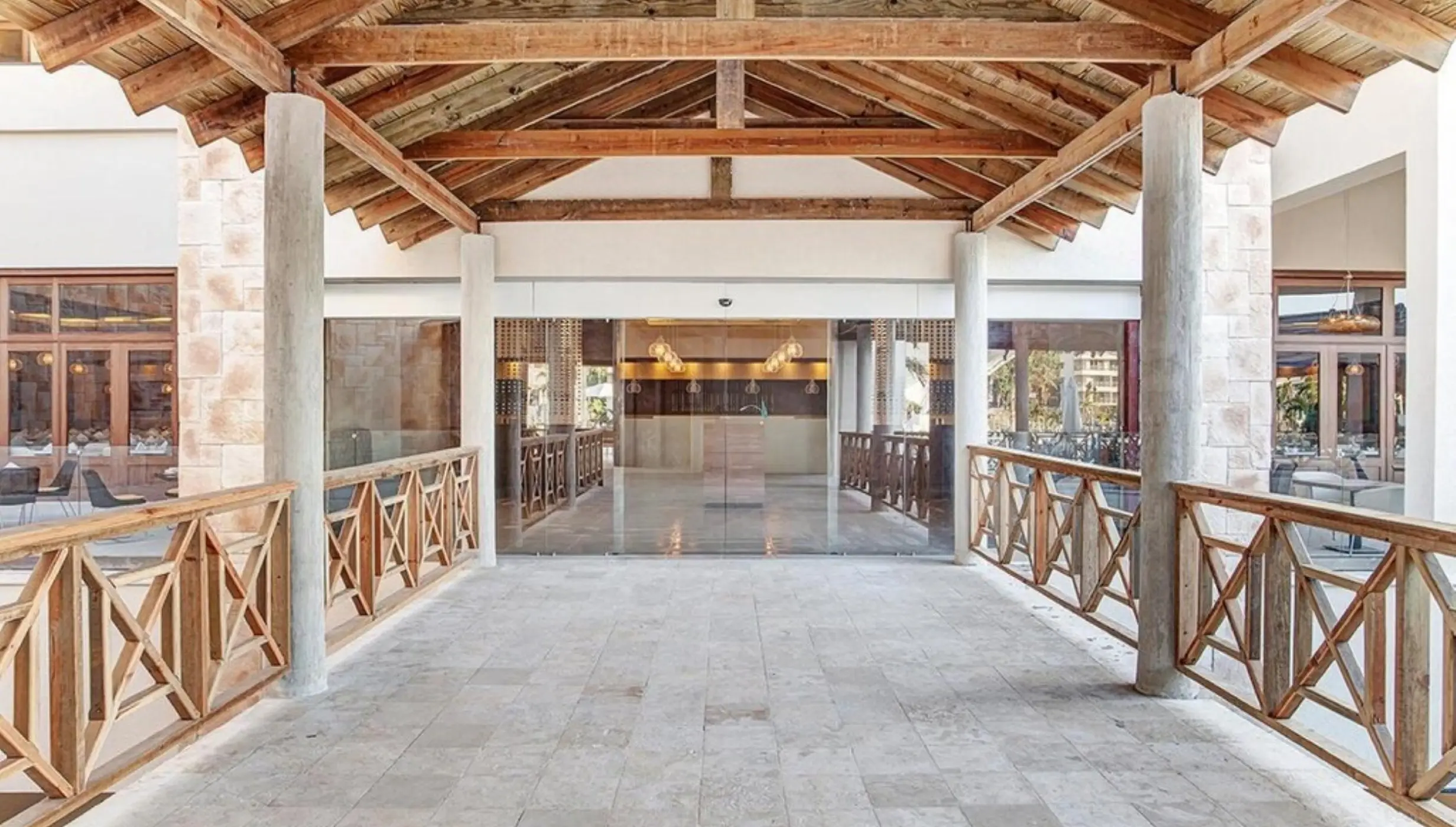 Covered lobby terrace with wooden beams and stone flooring at Royalton Saint Lucia, Castries