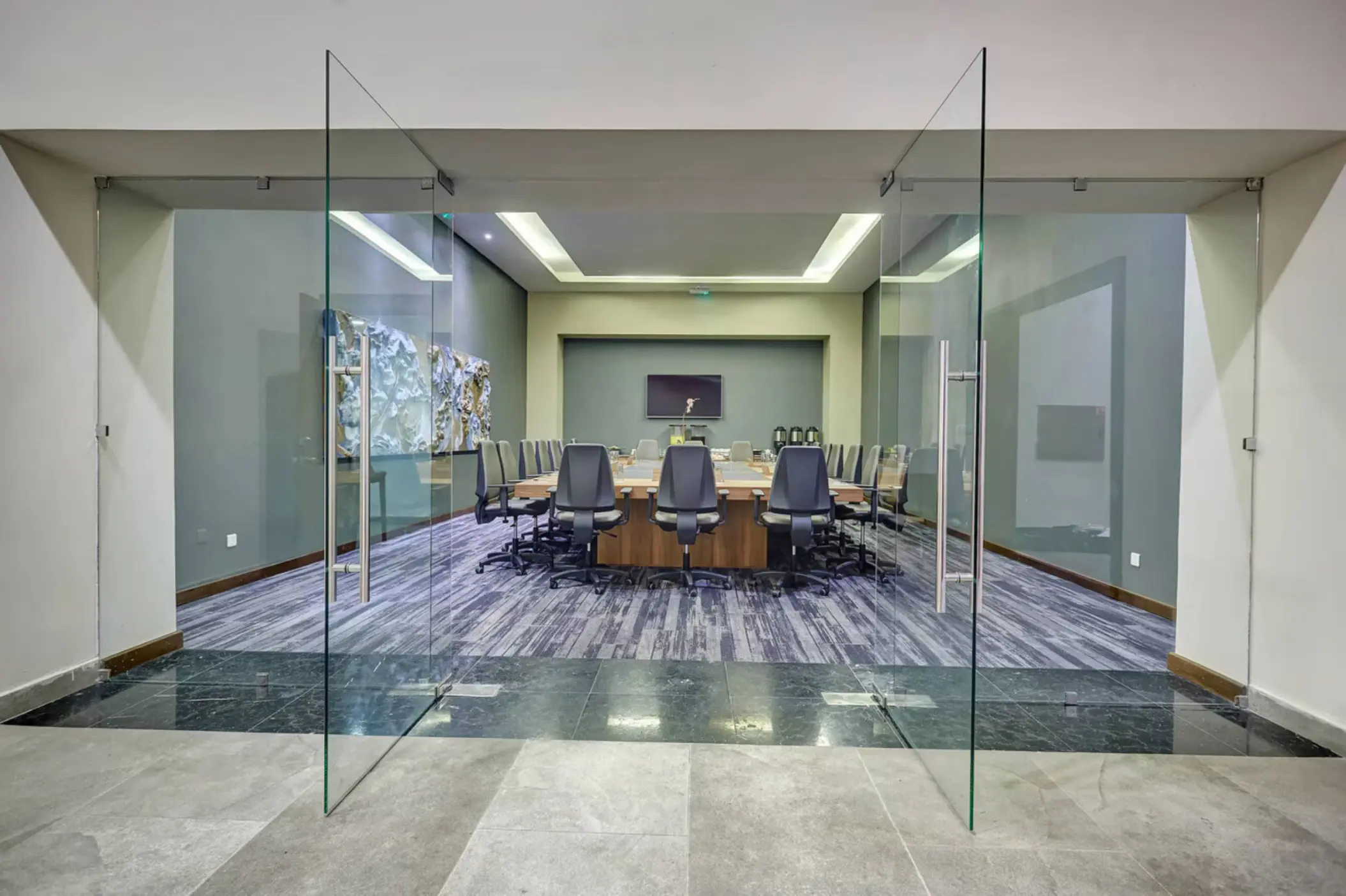Soufriere meeting room with a large conference table and glass doors at Royalton Saint Lucia, Castries