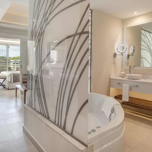 Modern suite bathroom with double vanity and soaking tub at Royalton Saint Lucia, Castries