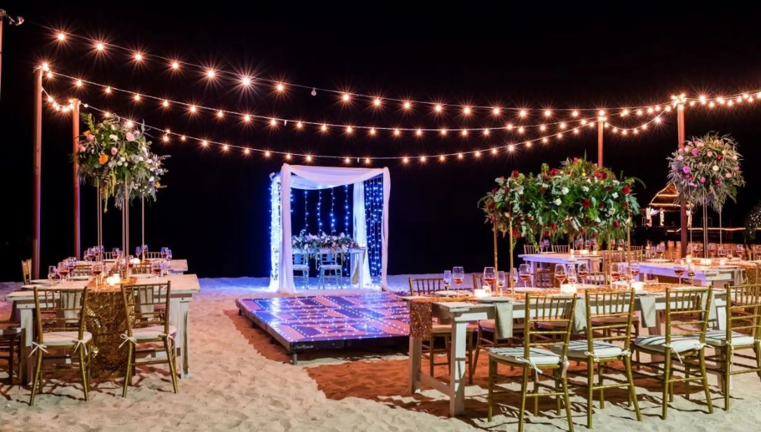 beach venue reception dinner setup at Secrets Aura Cozumel