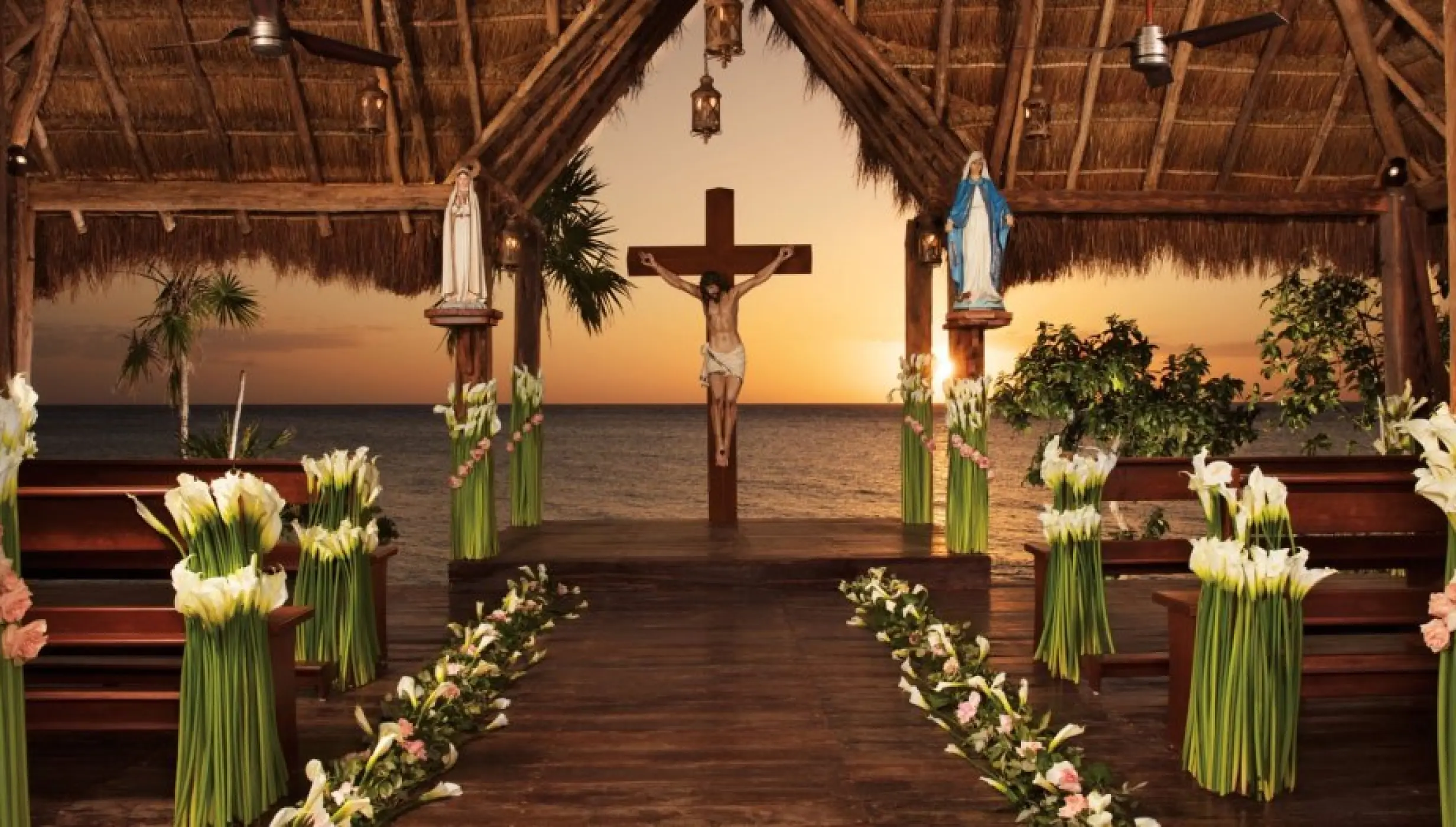 Catholic chapel ceremony setup with calla lilies and ocean views at Dreams Cozumel Cape