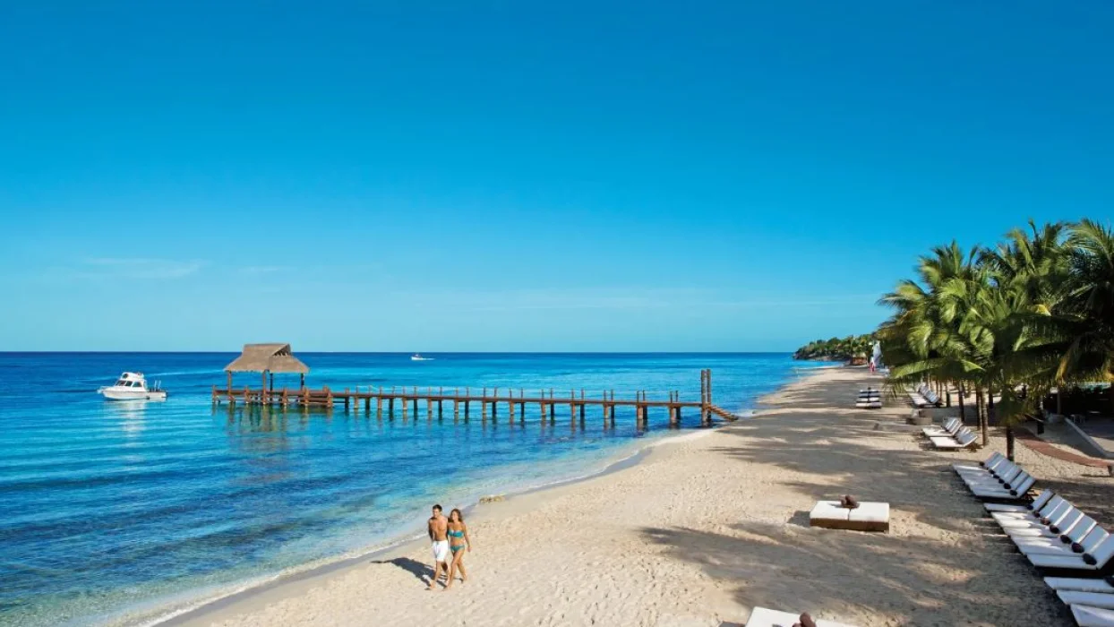 couple on the beach at Secrets Aura Cozumel