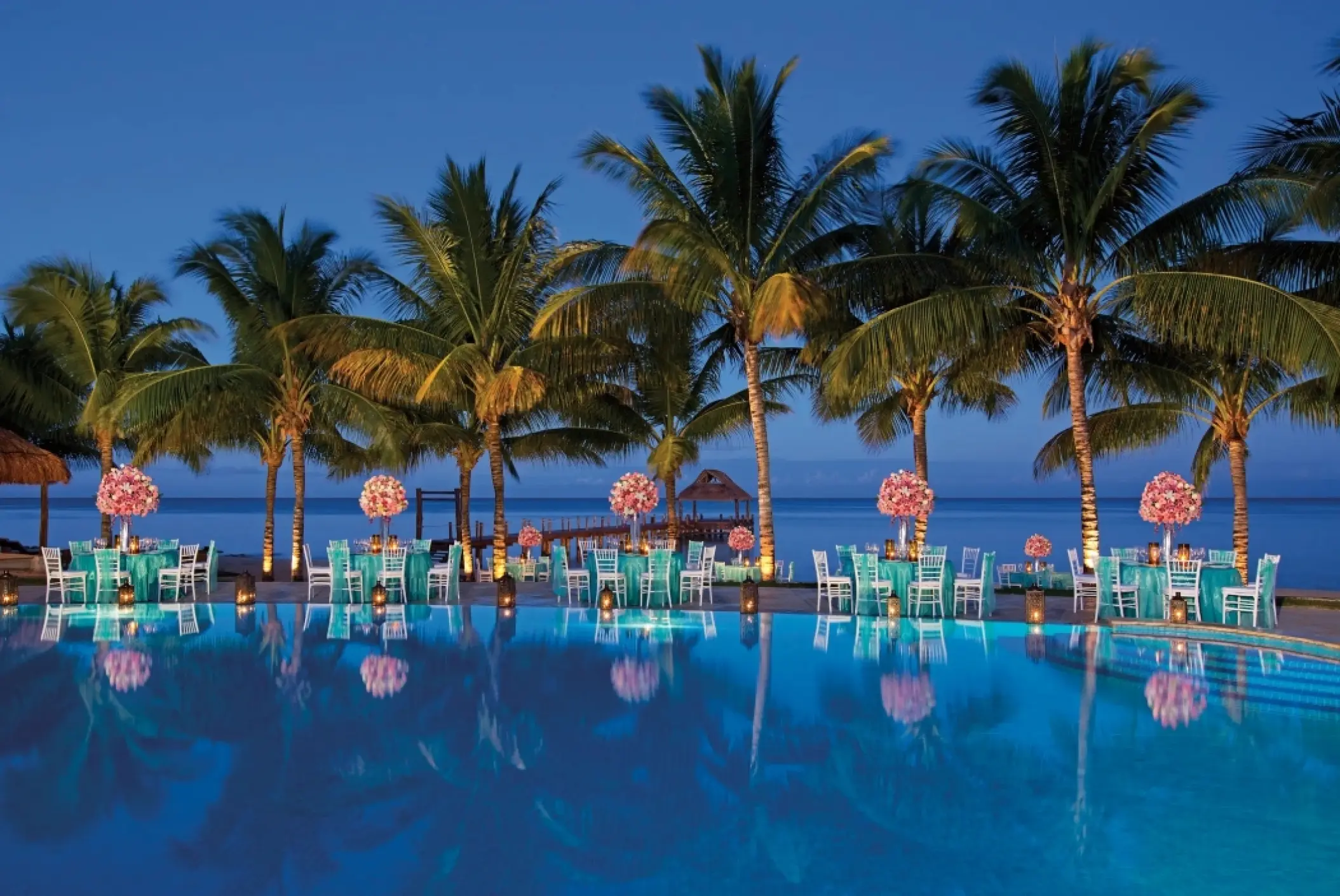 Poolside wedding reception at Secrets Aura Cozumel, Cozumel