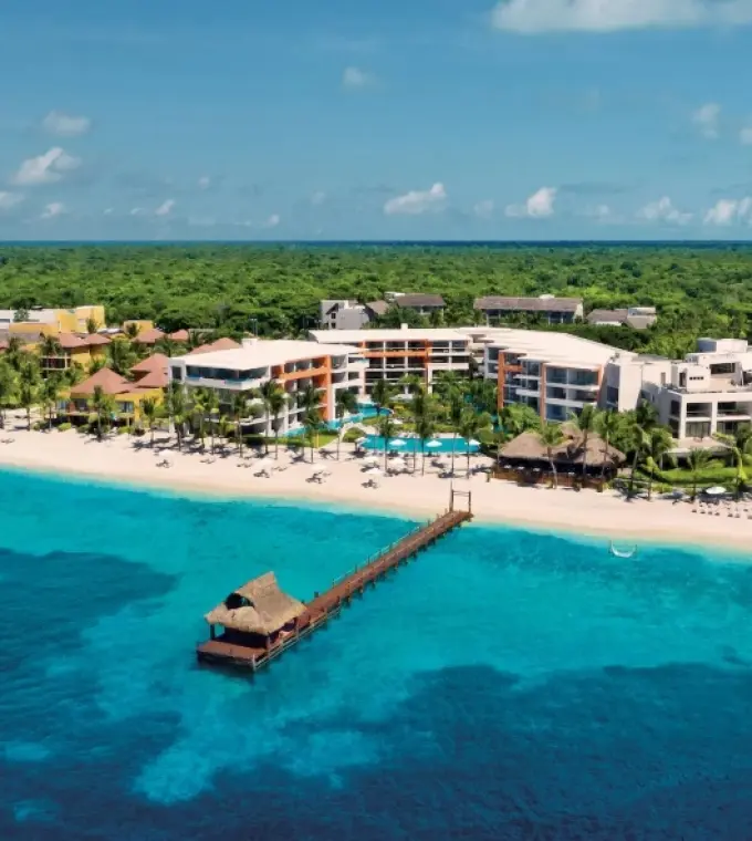 Aerial view of the beachfront and ocean pier at Secrets Aura Cozumel, Cozumel