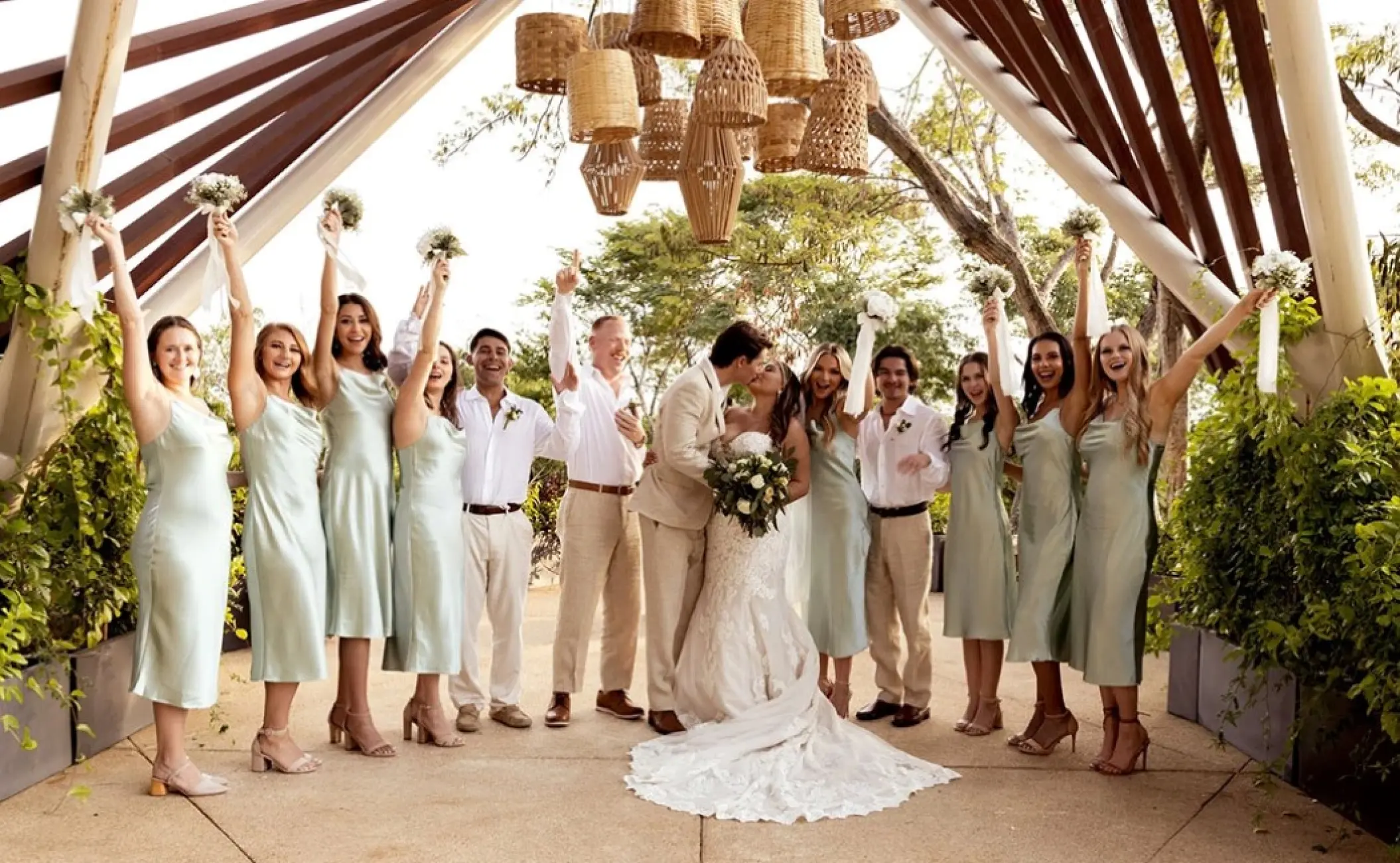 Wedding party cheering for a bride and groom's kiss at Secrets Bahia Mita, Puerto Vallarta