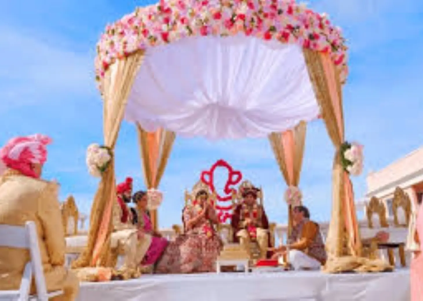 South Asian wedding ceremony under a floral mandap at Secrets Cap Cana, Punta Cana