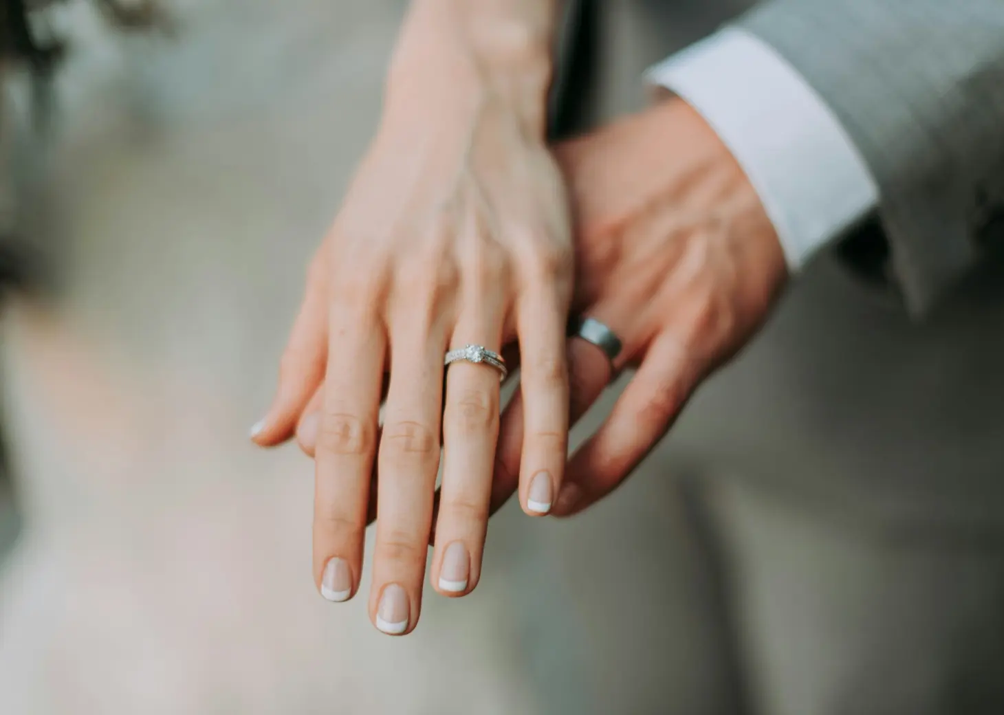 Close-up of the bride and groom showing their wedding rings at Secrets Mirabel, Cancun