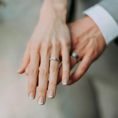 Close-up of the bride and groom showing their wedding rings at Secrets Mirabel, Cancun