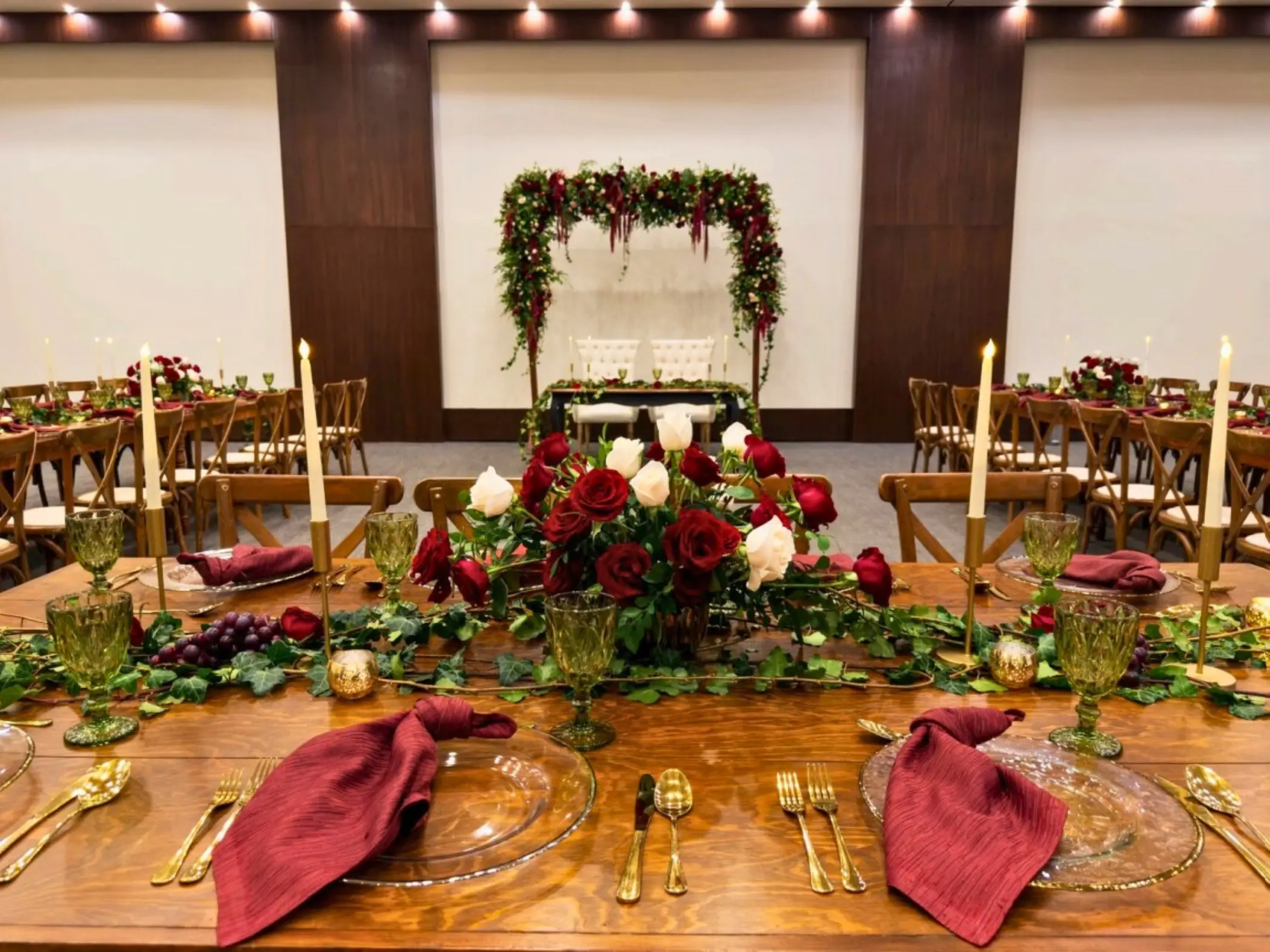 Nizuc Ballroom wedding reception with red roses and wood tables at Secrets Mirabel, Cancun