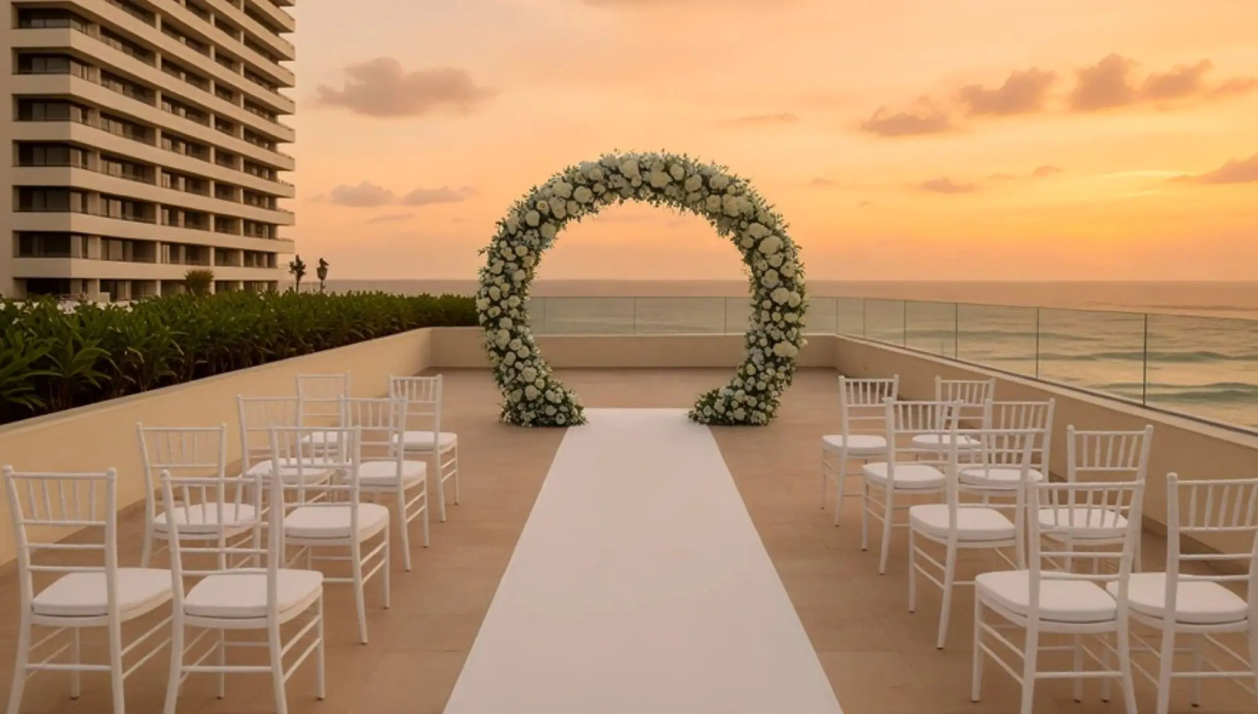 Rooftop wedding ceremony setup with a floral arch at Secrets Mirabel Cancun, Cancun