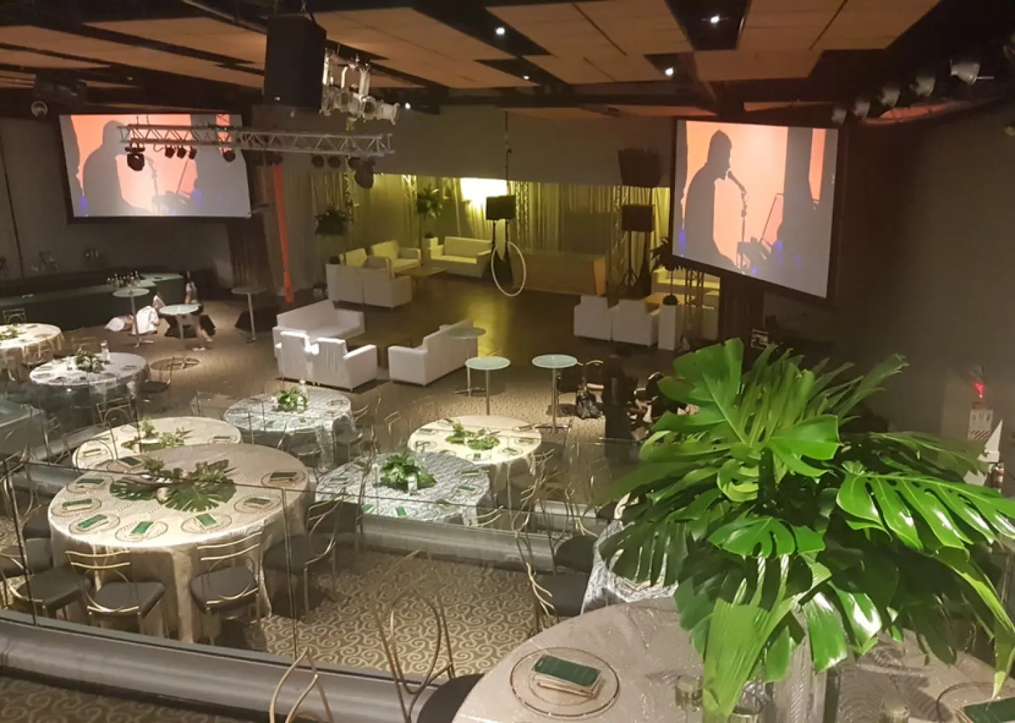Amphitheater wedding reception setup with round tables and screens at Secrets Papagayo, Papagayo