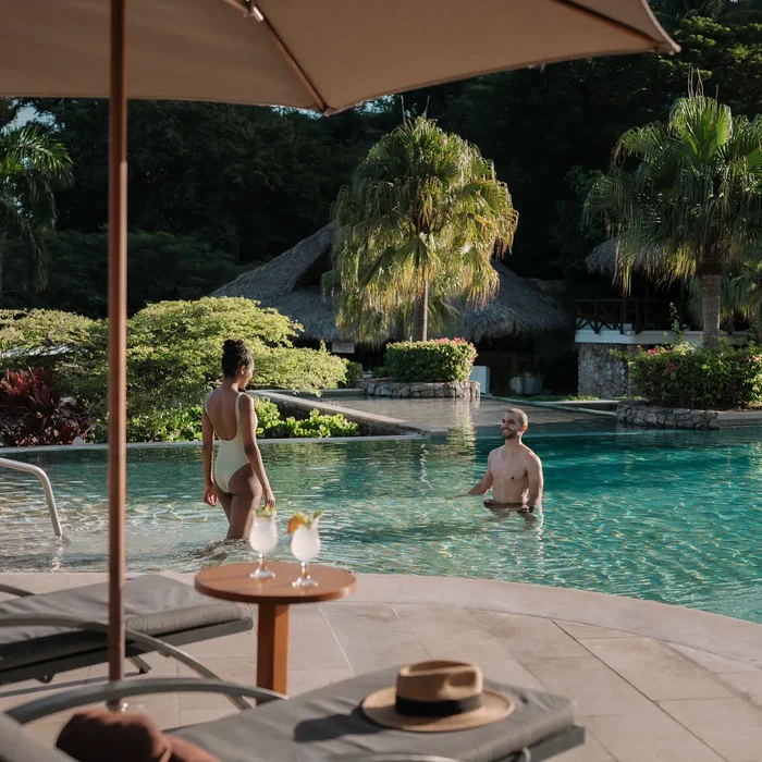 couple in the pool at Secrets Papagayo Costa Rica