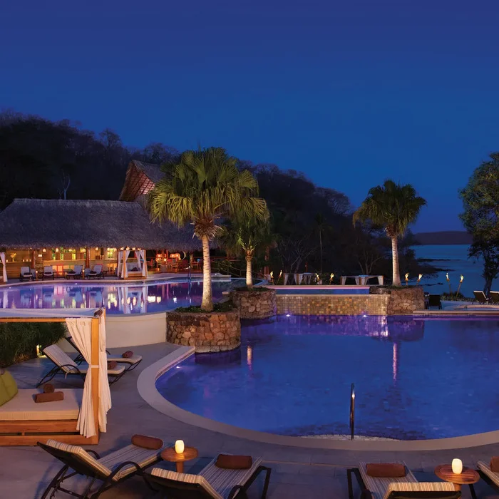 main pool area at night at Secrets Papagayo Costa Rica