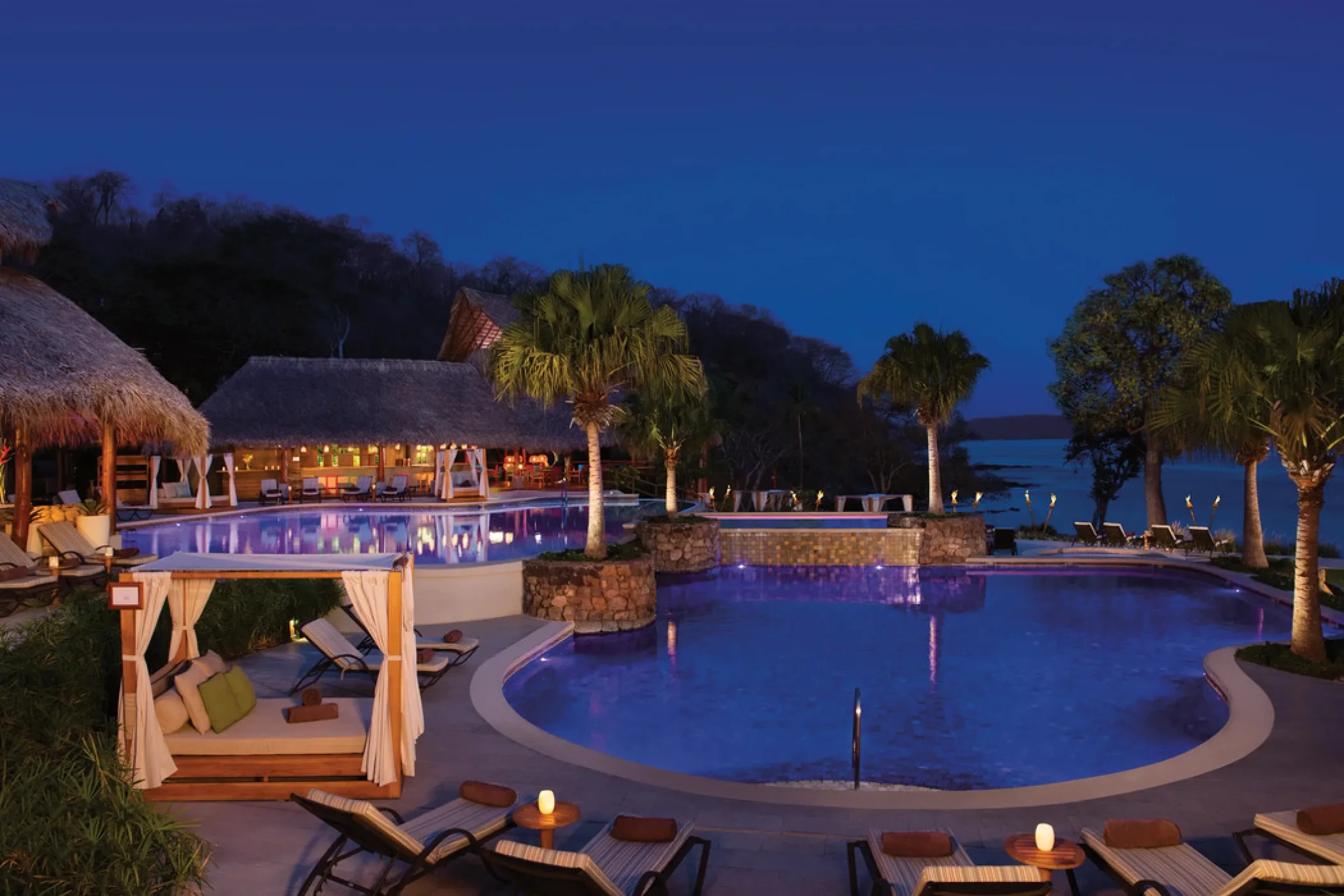 main pool area at night at Secrets Papagayo Costa Rica