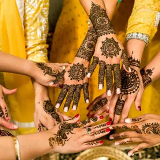 Intricate henna designs on hands during a South Asian wedding mehendi at Secrets Papagayo, Costa Rica