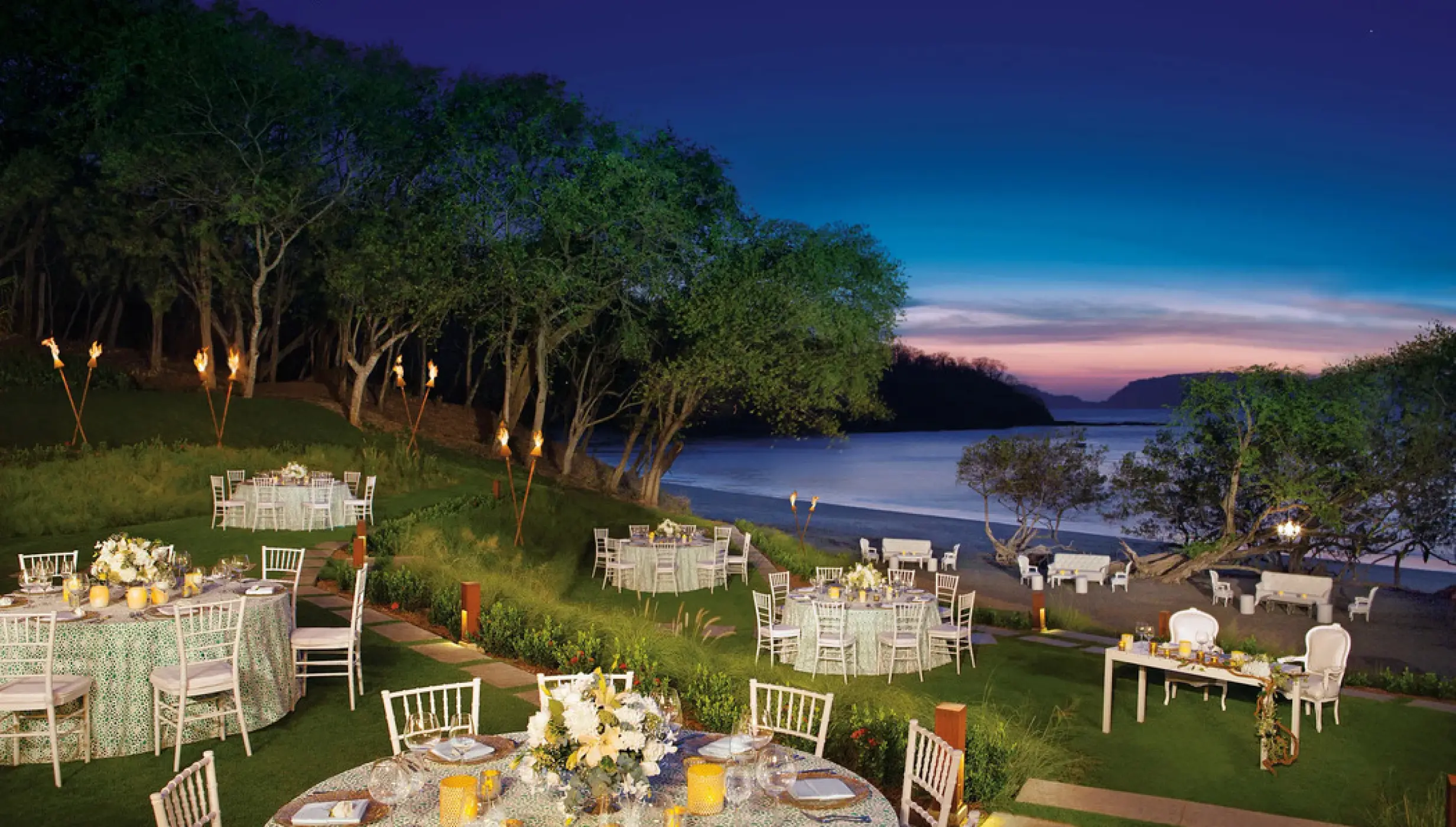 Garden wedding reception at sunset with beach views at Secrets Papagayo, Papagayo