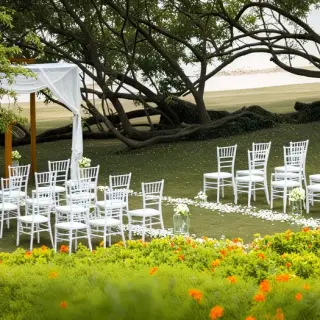 Spa garden wedding ceremony with white chairs and gazebo at Secrets Papagayo, Papagayo
