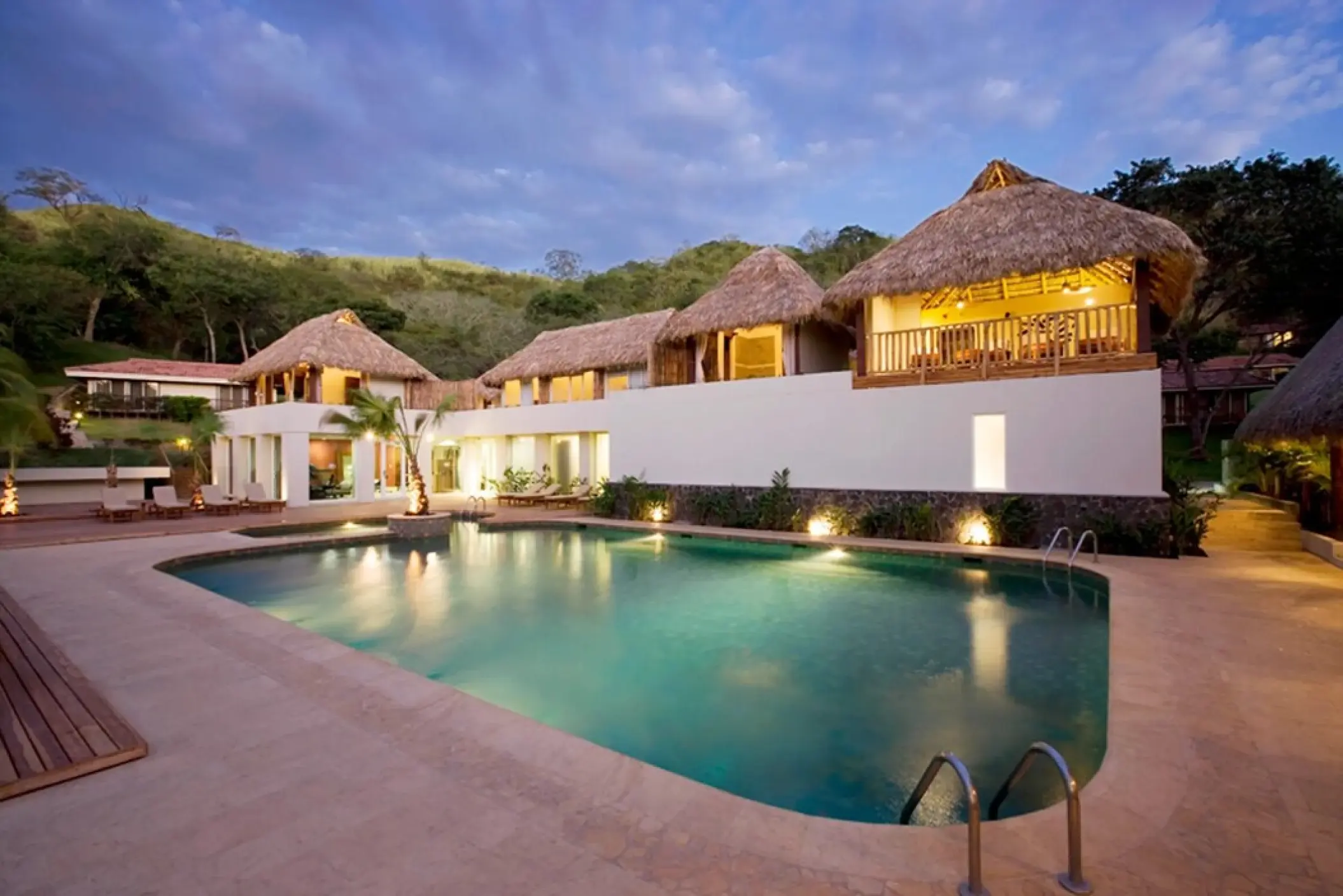 Spa pool deck and palapa-roofed buildings at Secrets Papagayo, Papagayo