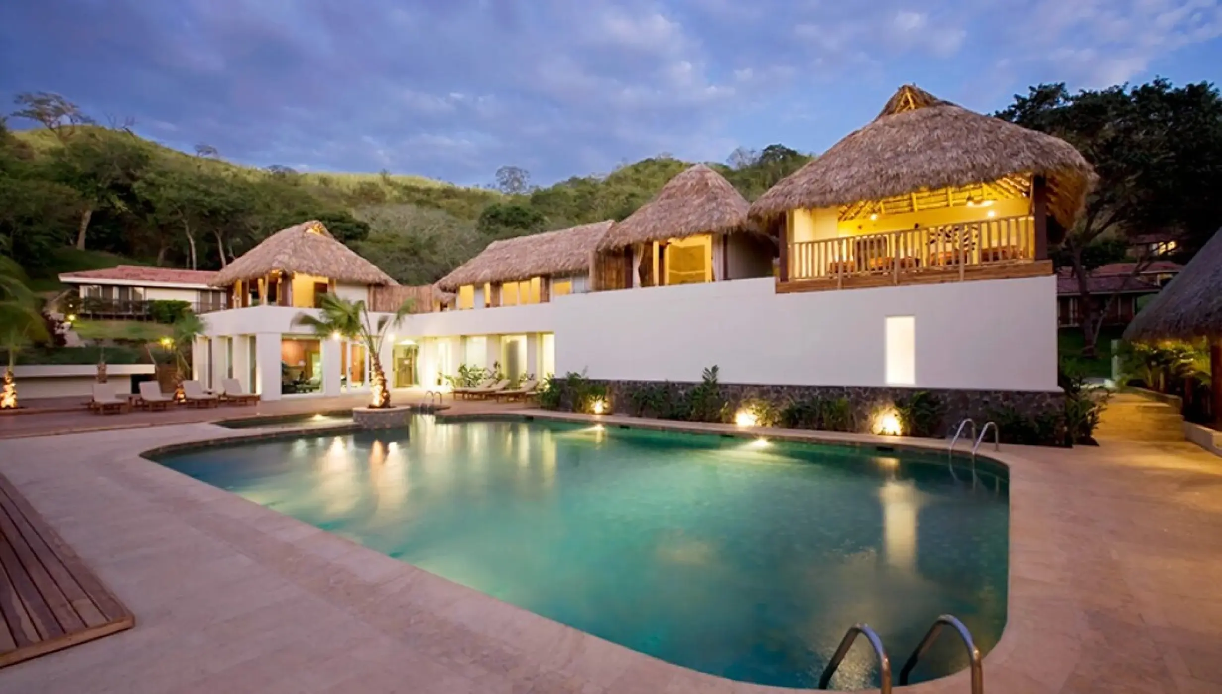 Spa pool deck and palapa-roofed buildings at Secrets Papagayo, Papagayo