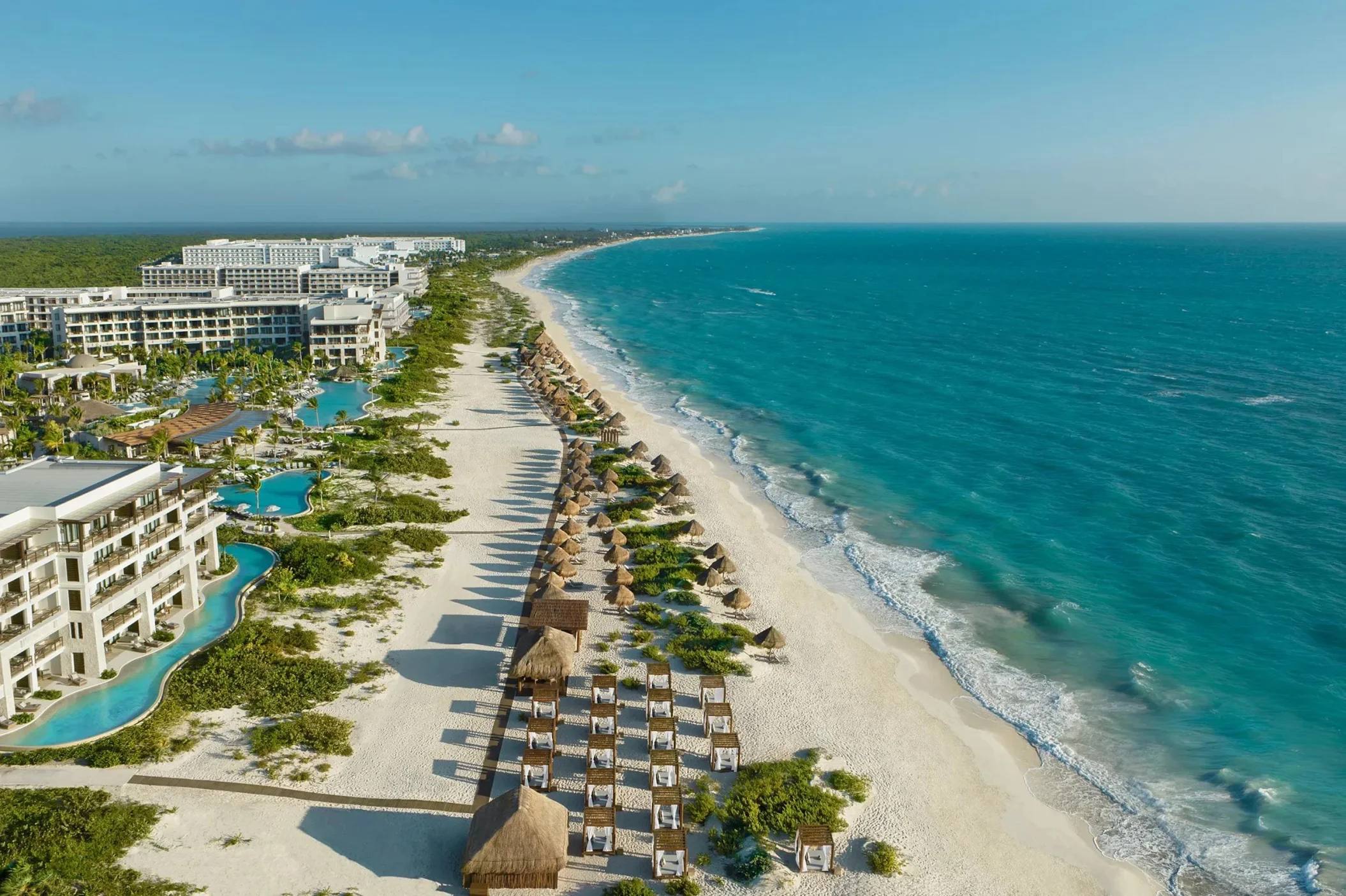 beach, pools and resort buildings at Secrets Playa Blanca Costa Mujeres