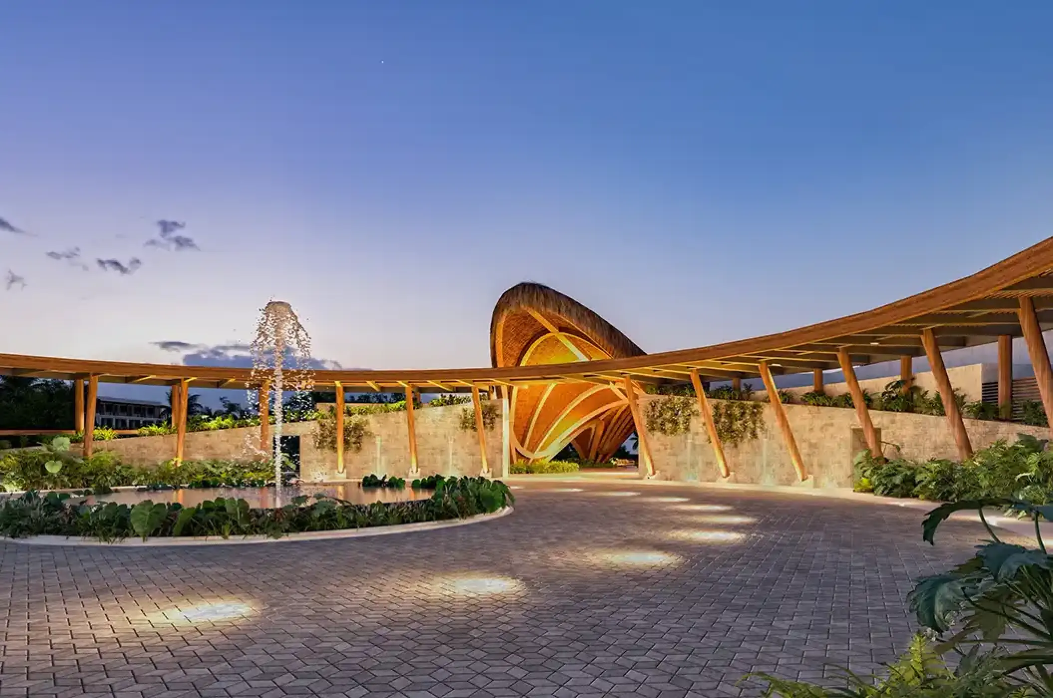 Modern curved motor lobby entrance and water fountain at Secrets Playa Blanca Costa Mujeres, Cancun