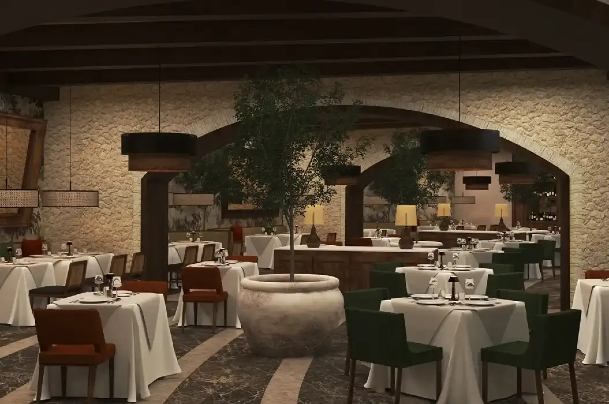 Portofino restaurant dining area with stone walls at Secrets Playa Blanca, Cancun