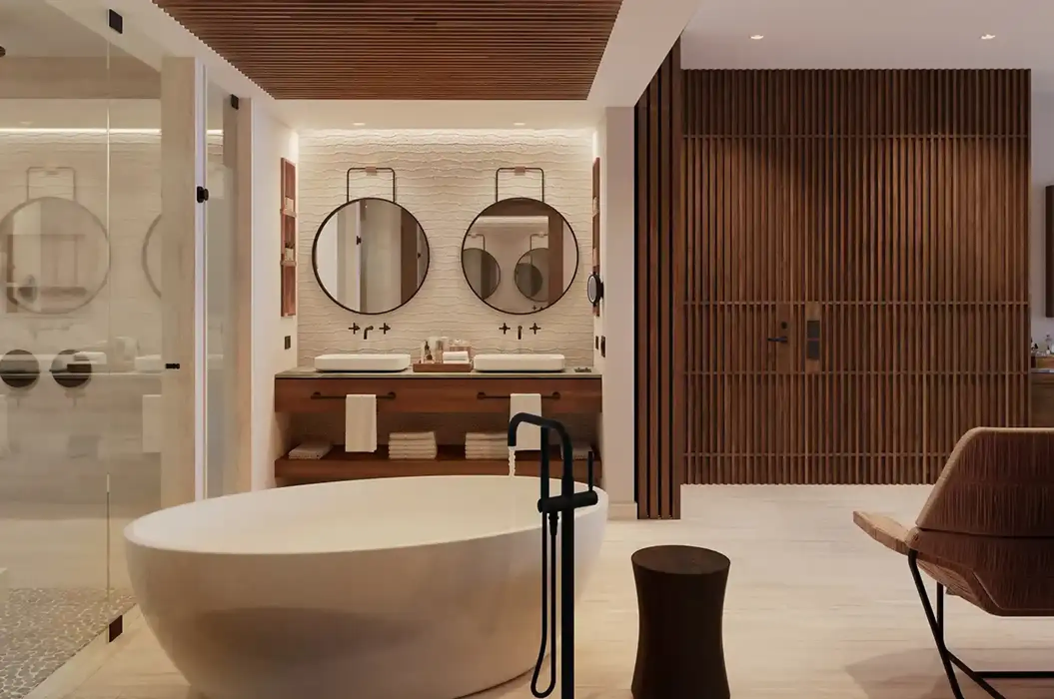 Junior Suite bathroom with a freestanding tub and double vanity at Secrets Playa Blanca, Cancun